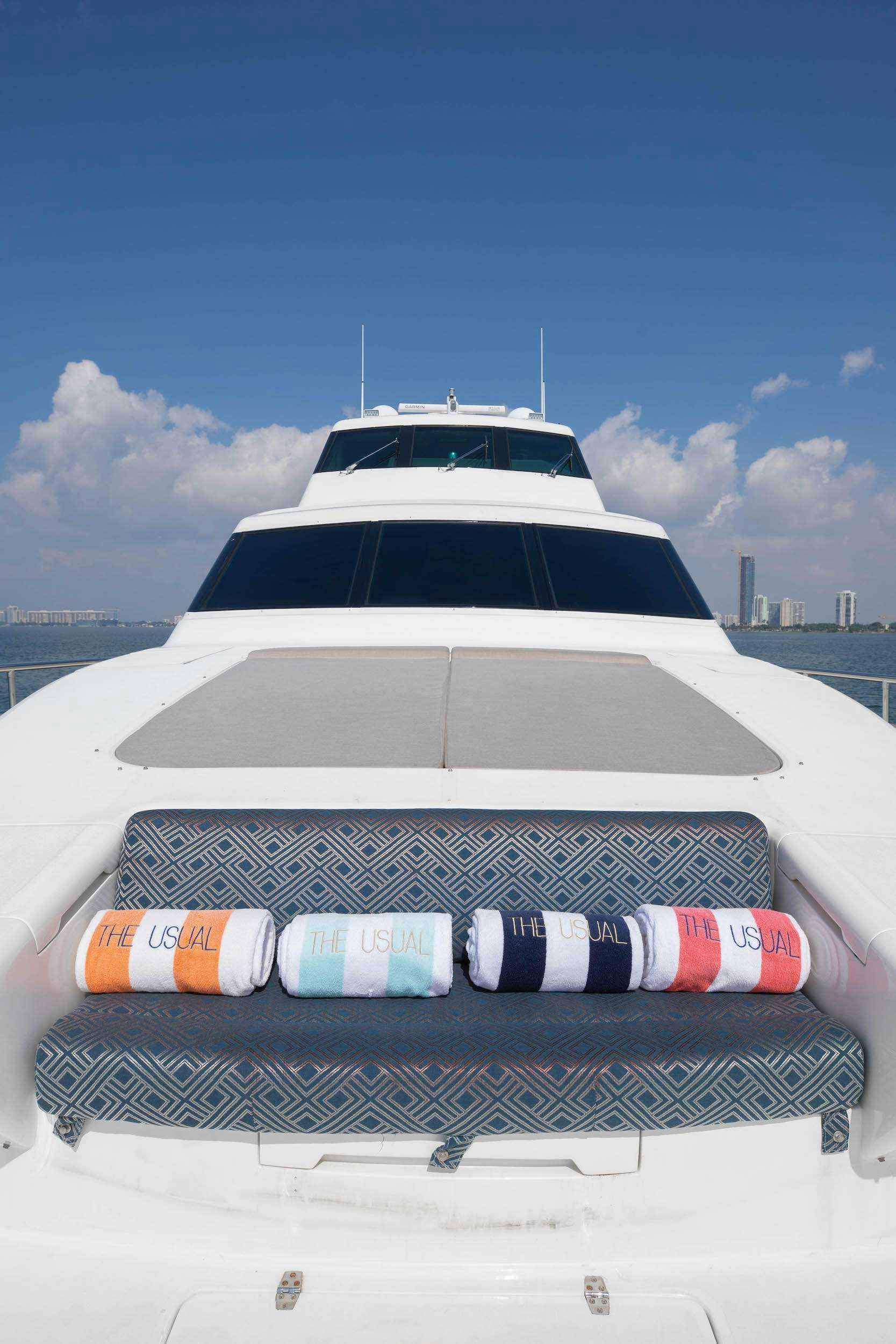 a white car with red and blue lights on it aboard THE USUAL Yacht for Charter