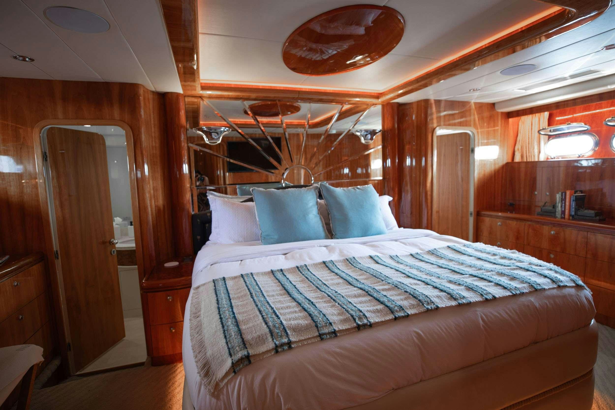 a bed in a cabin aboard THE USUAL Yacht for Charter