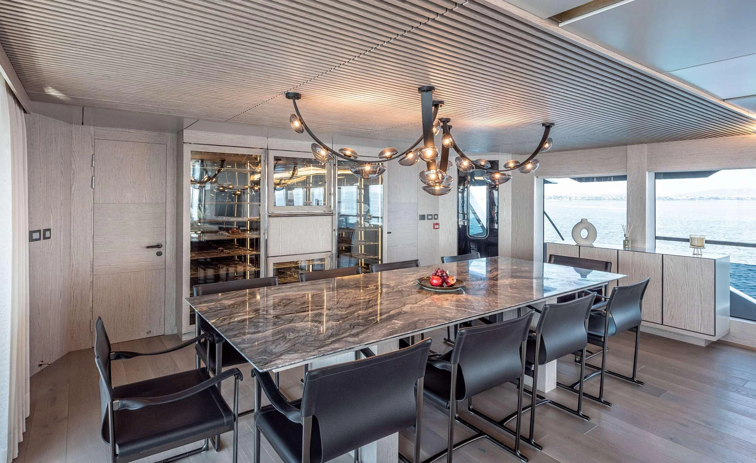 a large kitchen with a large island aboard EAU LA LA Yacht for Charter