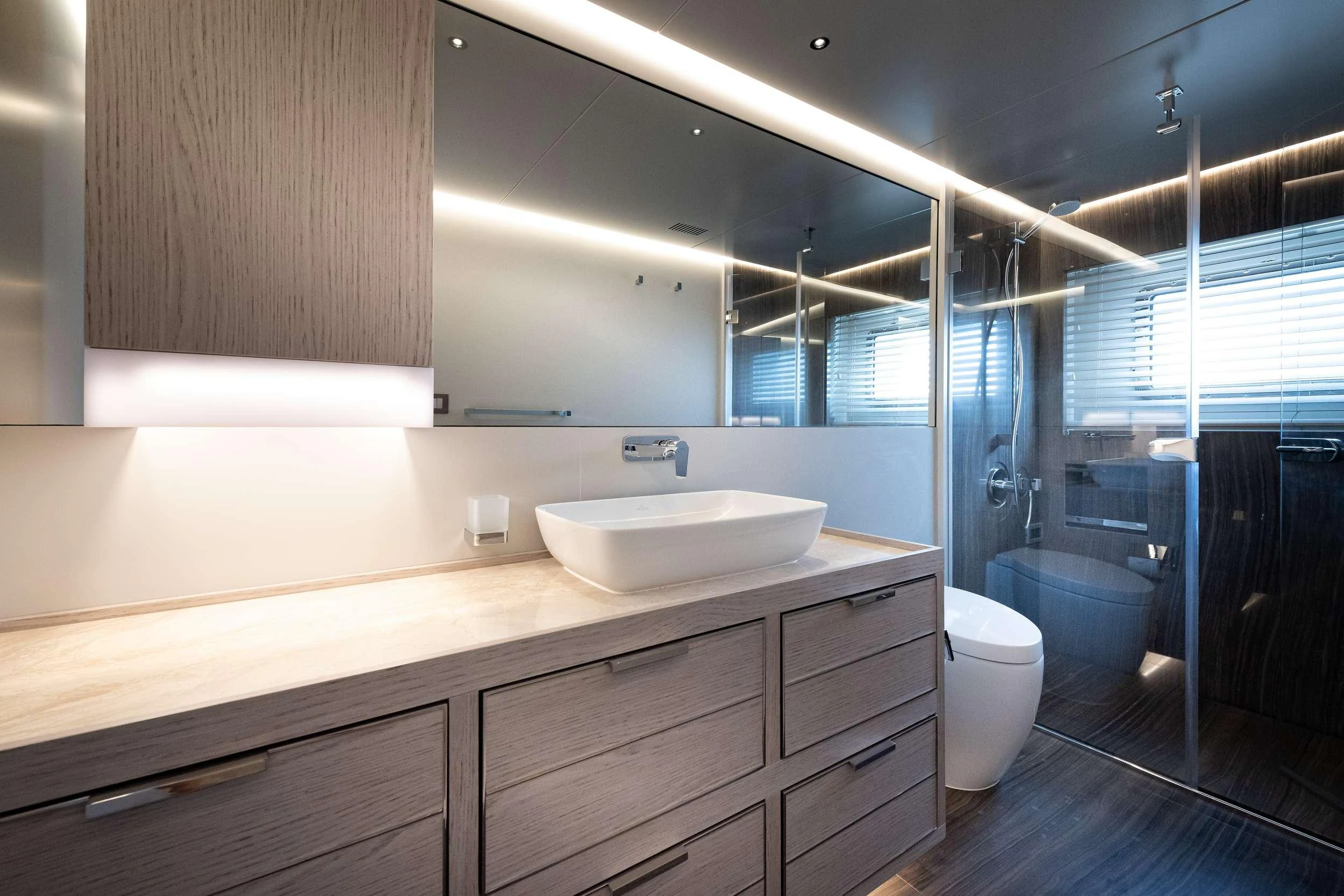 a bathroom with a sink and a toilet aboard EAU LA LA Yacht for Charter