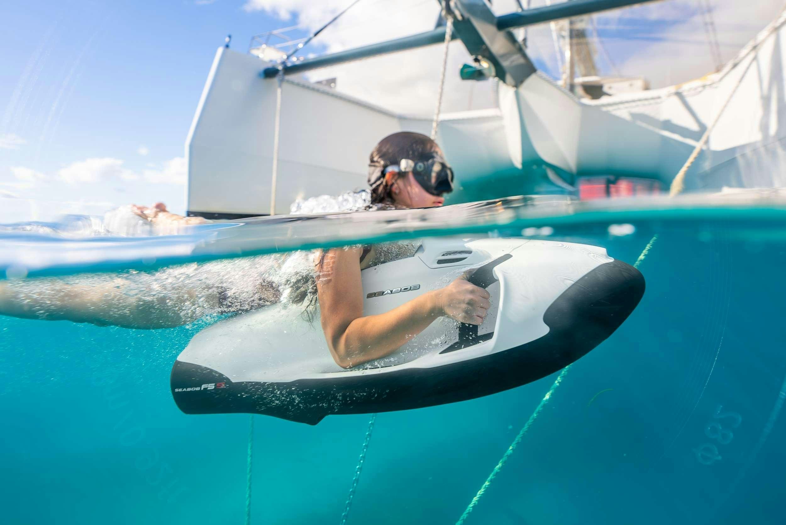 a person in a goggles in a sailboat aboard NDS EVOLUTION Yacht for Charter