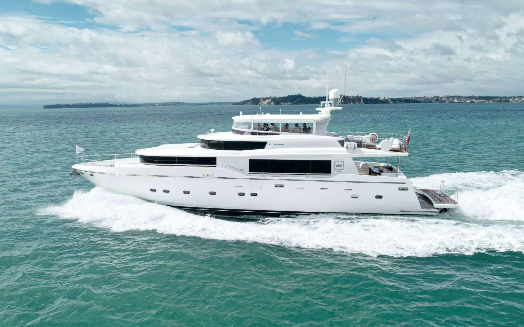 a white boat on the water aboard WW Yacht for Charter