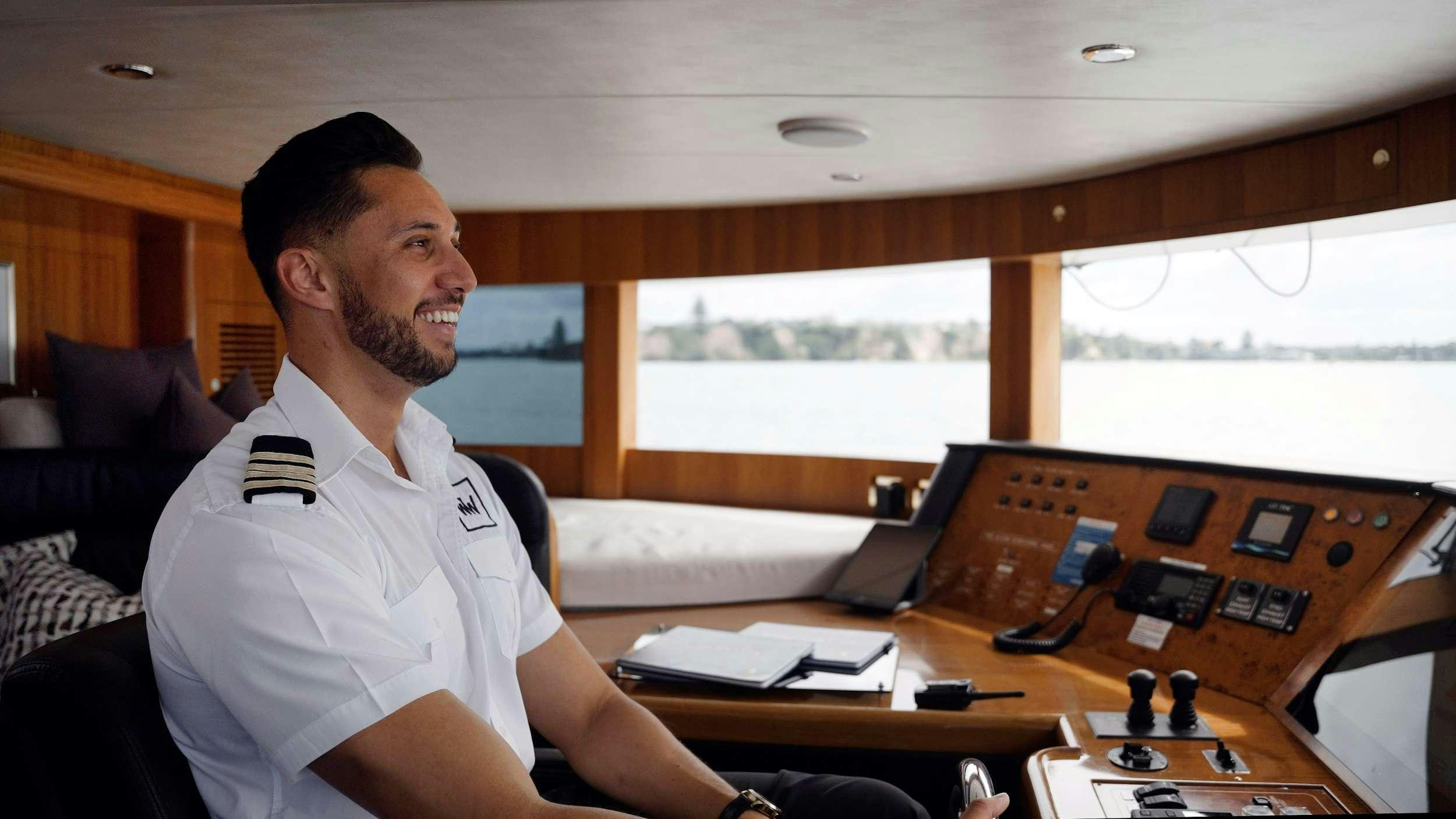 a person sitting in a chair aboard WW Yacht for Charter