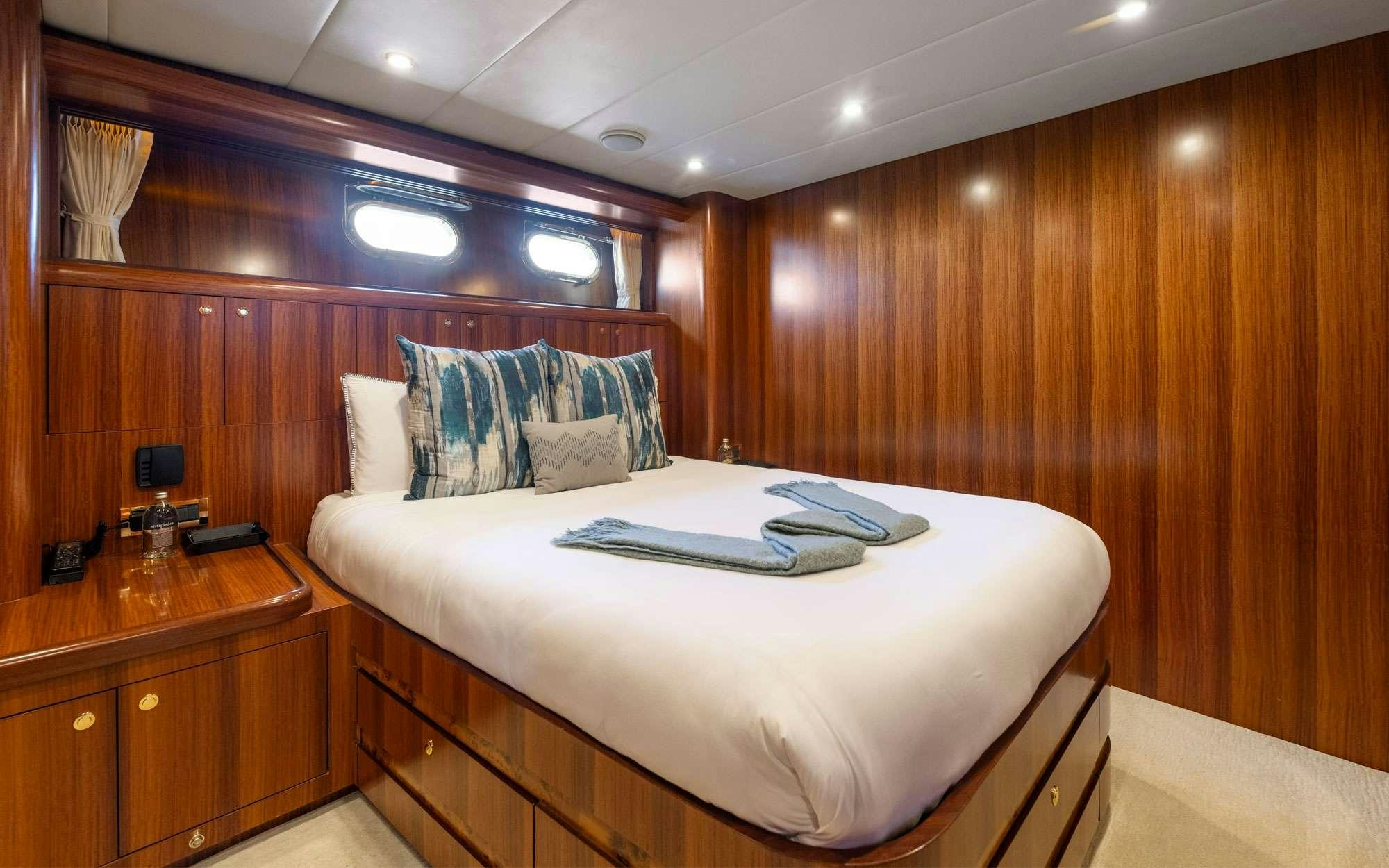 a bed in a room aboard WW Yacht for Charter