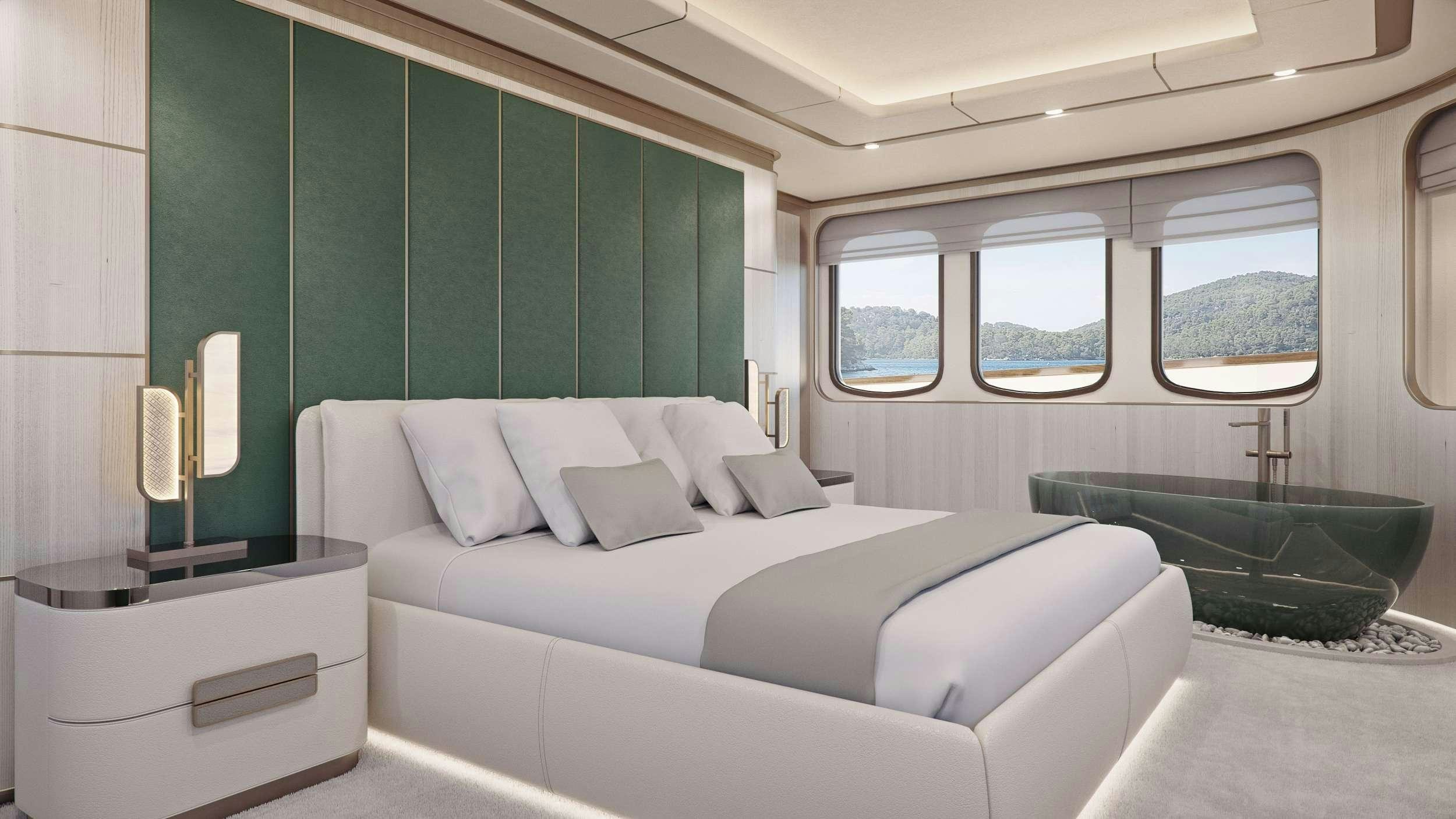 a white bed in a room aboard MAIA Yacht for Charter