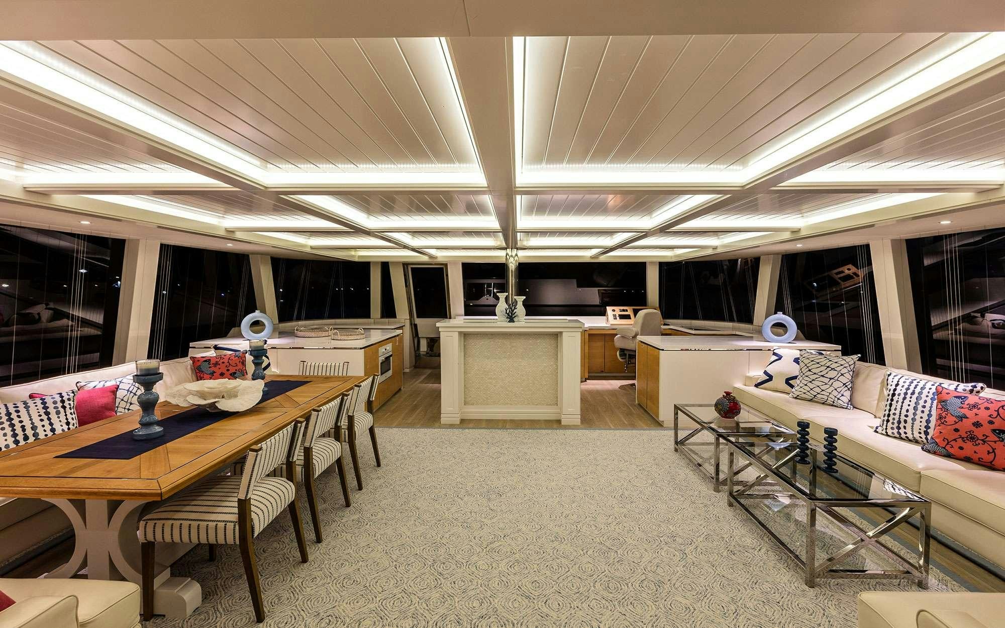 a large living room with a large open floor plan aboard BUNDALONG Yacht for Charter