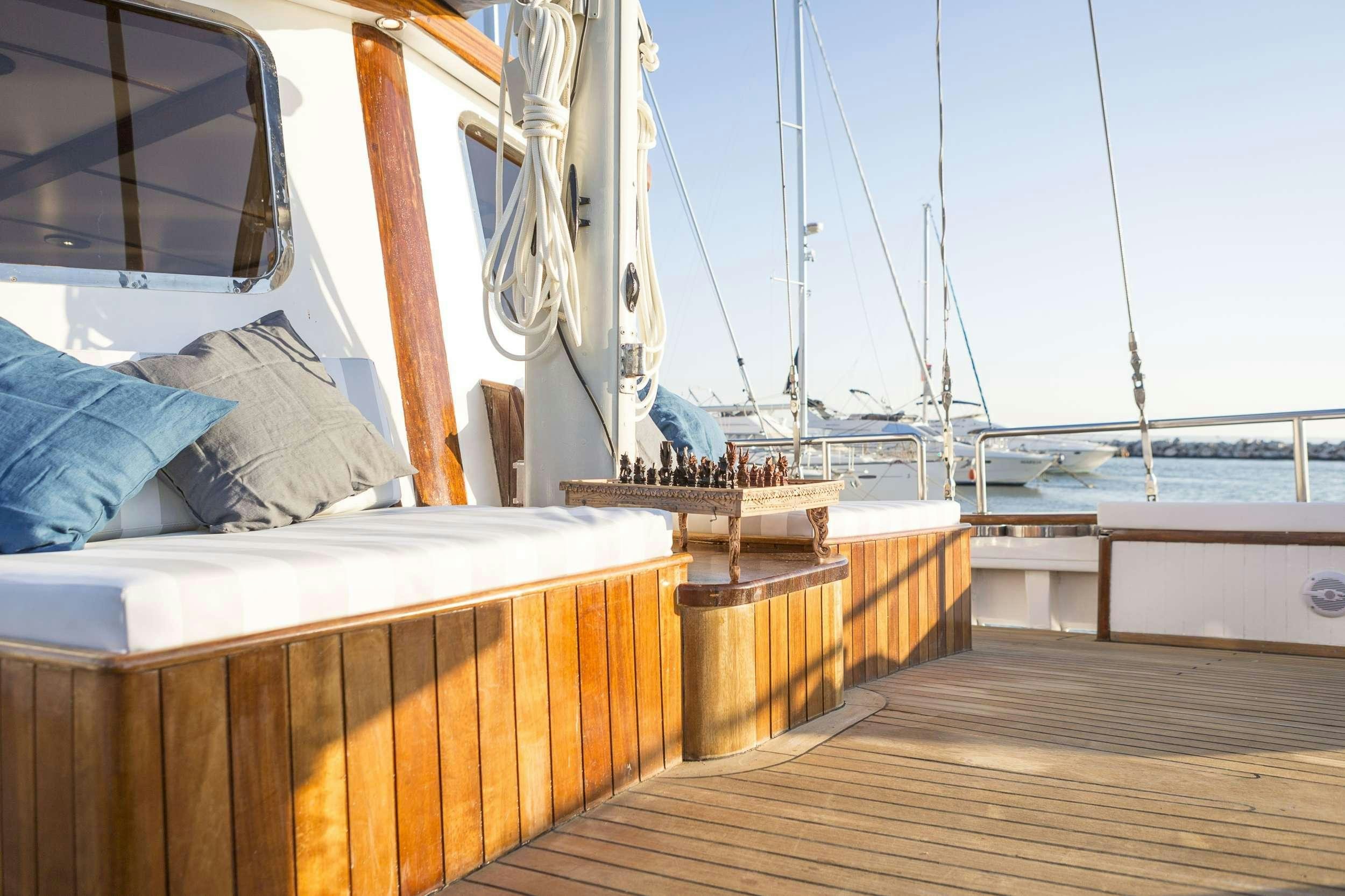 a boat on the water aboard COSMOS Yacht for Charter