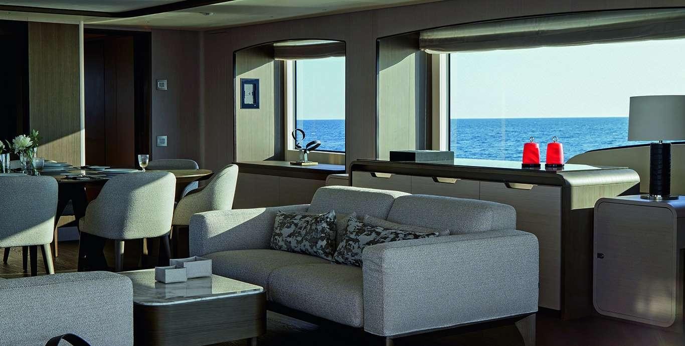 a living room with a large window aboard WATERCOLOURS Yacht for Charter