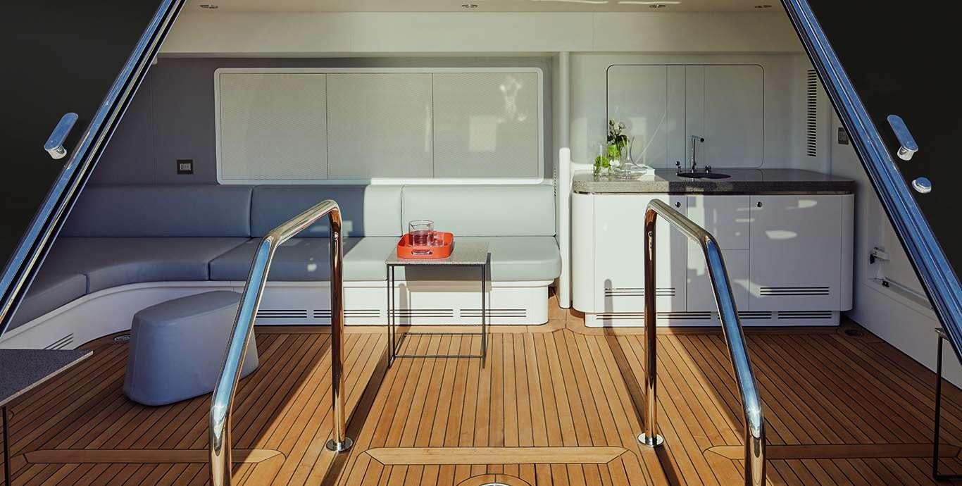 a kitchen with a table and chairs aboard WATERCOLOURS Yacht for Charter
