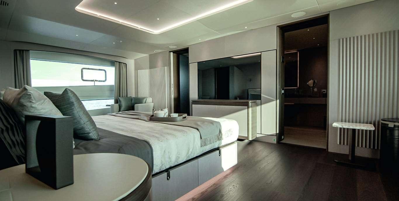 a room with a bed and a couch aboard WATERCOLOURS Yacht for Charter