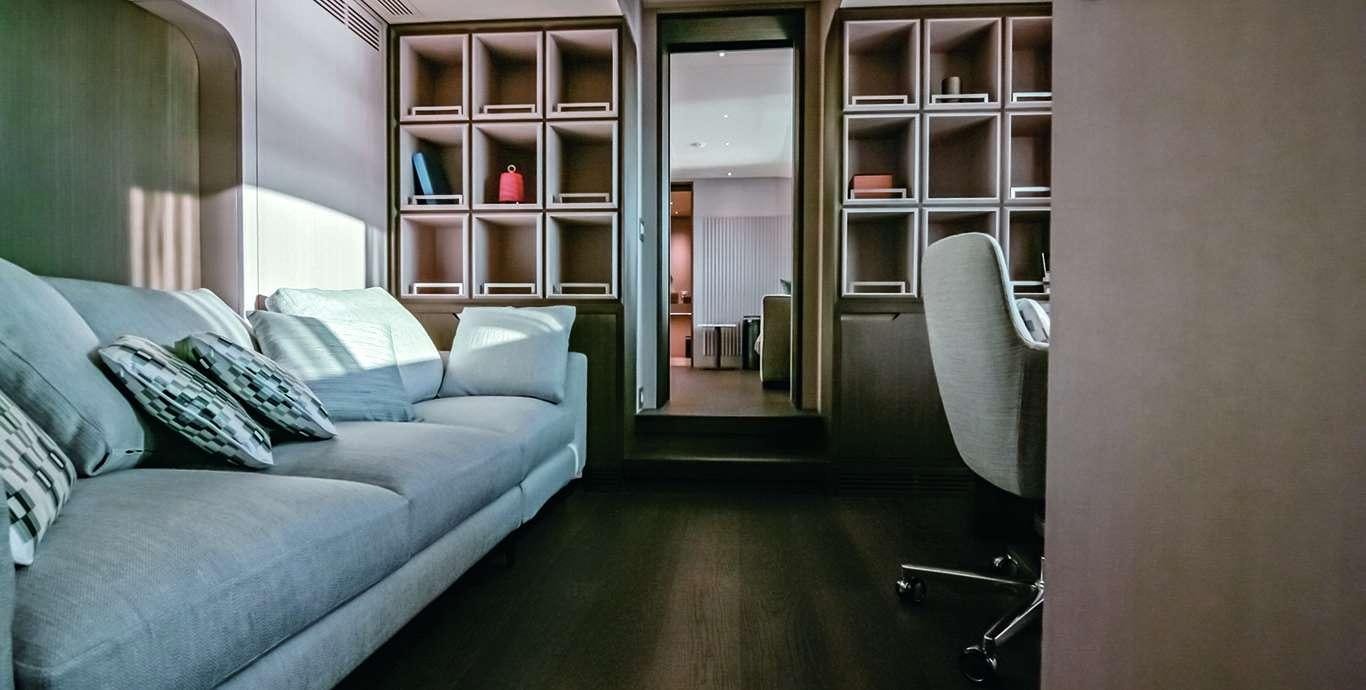 a living room with a couch and a glass door aboard WATERCOLOURS Yacht for Charter