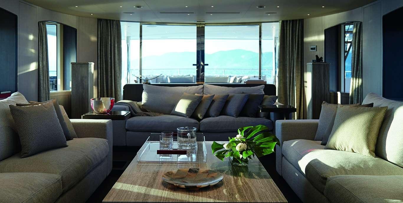 a living room with a large window aboard WATERCOLOURS Yacht for Charter