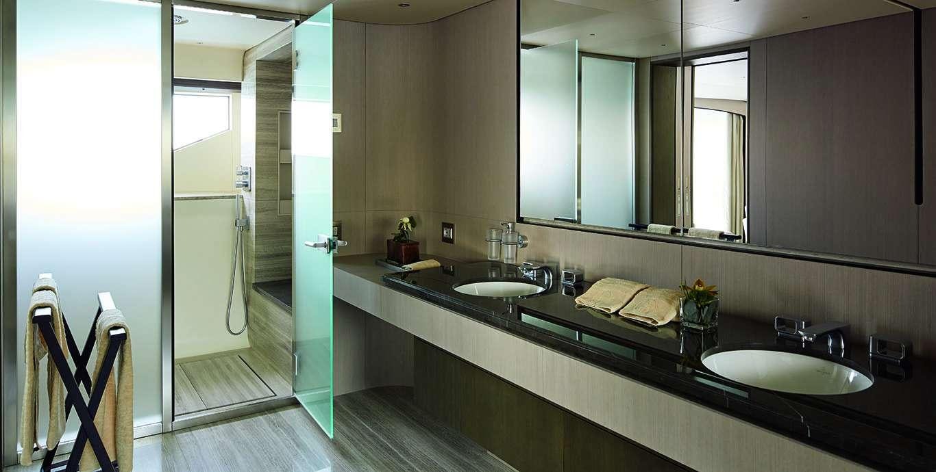 a bathroom with sinks and mirrors aboard WATERCOLOURS Yacht for Charter