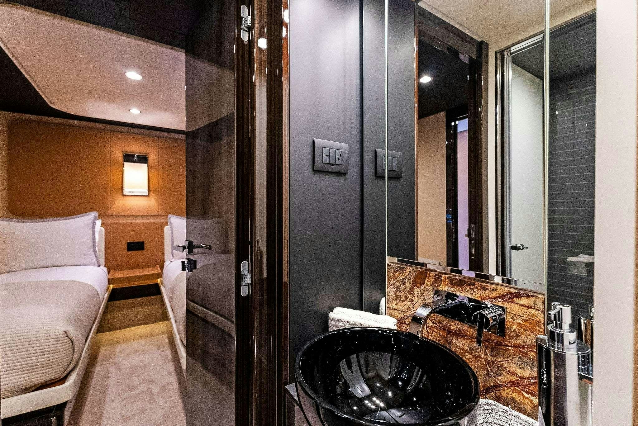 a bathroom with a large mirror aboard FANTASTIC Yacht for Charter