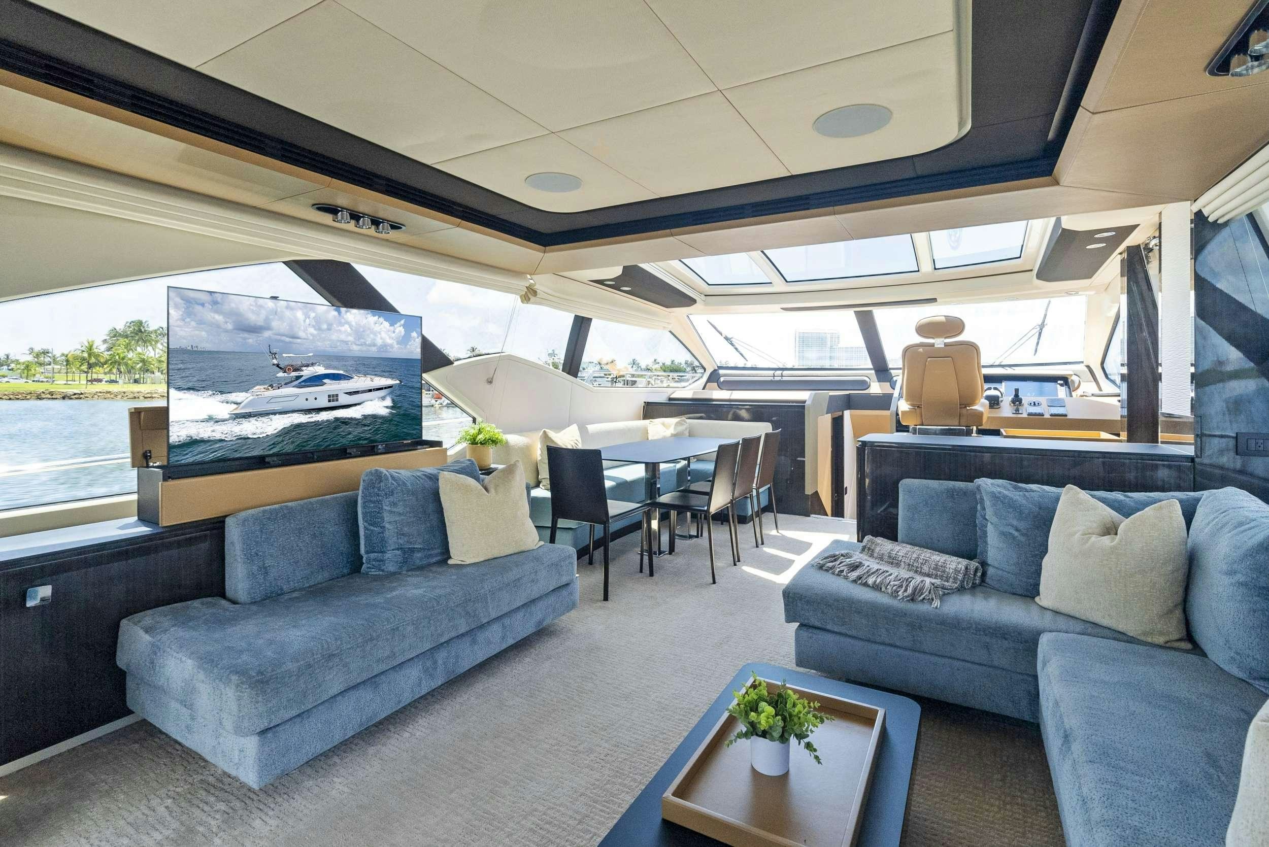a living room with a large window aboard FANTASTIC Yacht for Charter