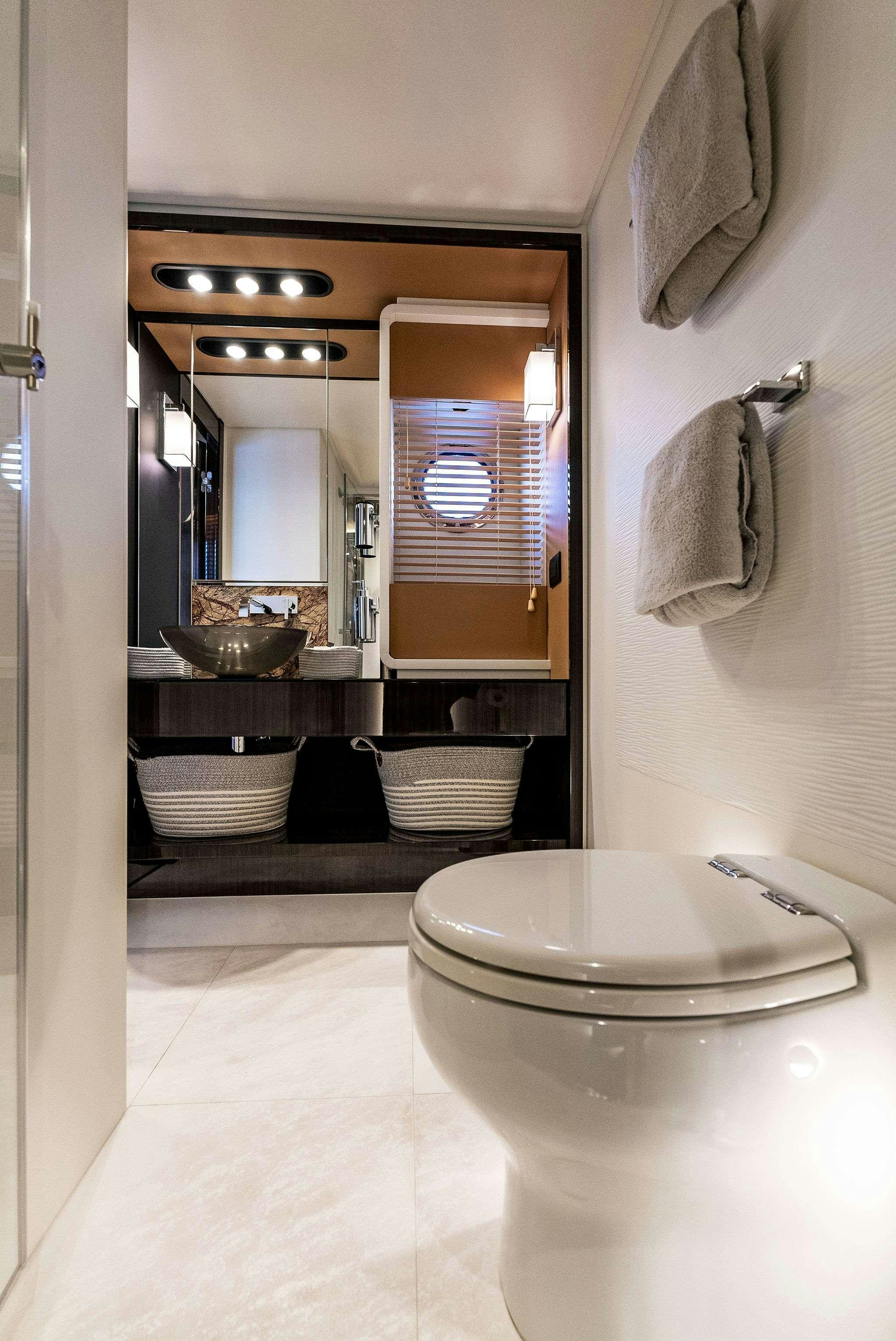 a bathroom with a sink and a mirror aboard FANTASTIC Yacht for Charter