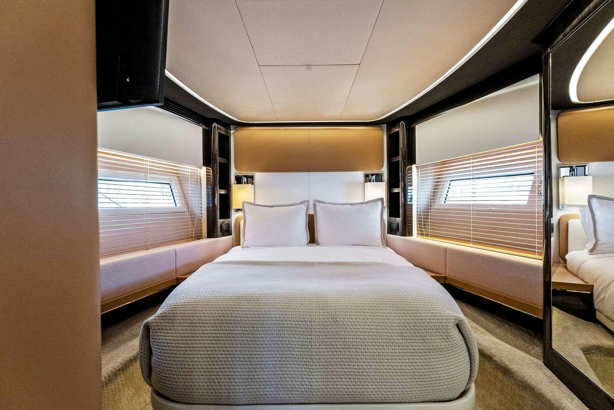 a room with a bed and a window aboard FANTASTIC Yacht for Charter