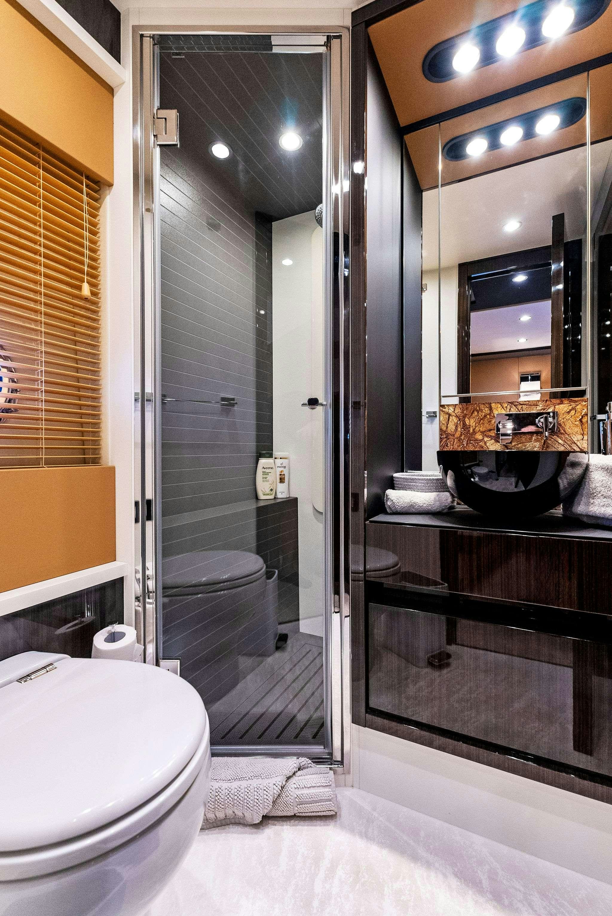 a bathroom with a glass shower aboard FANTASTIC Yacht for Charter