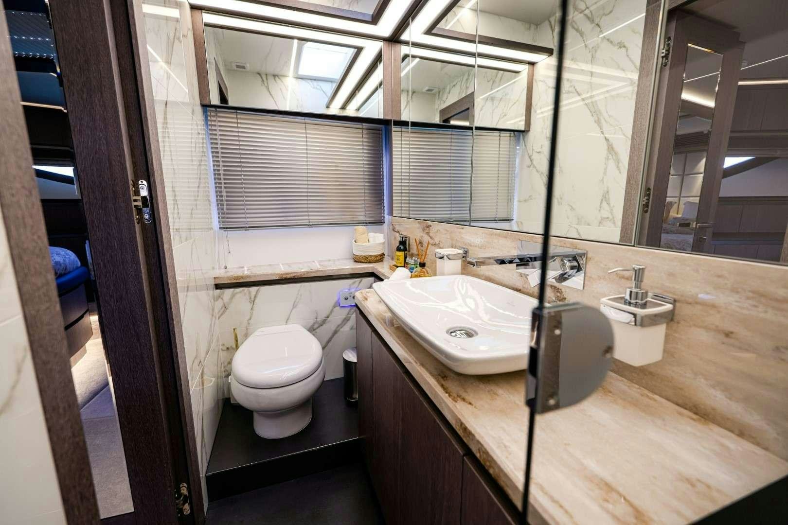 a bathroom with a sink and toilet aboard FG STAR Yacht for Charter