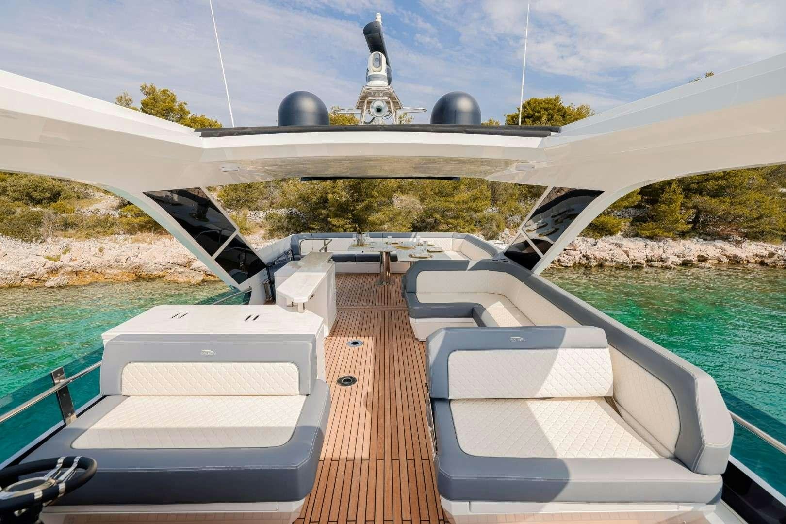 a deck with a large building in the background aboard FG STAR Yacht for Charter