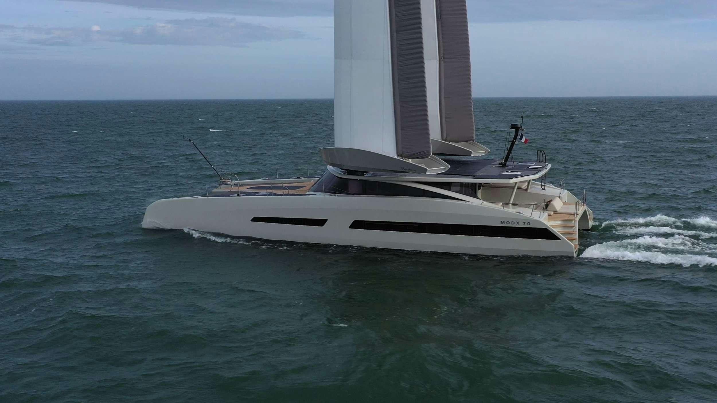 a white boat in the water aboard GANANY Yacht for Charter