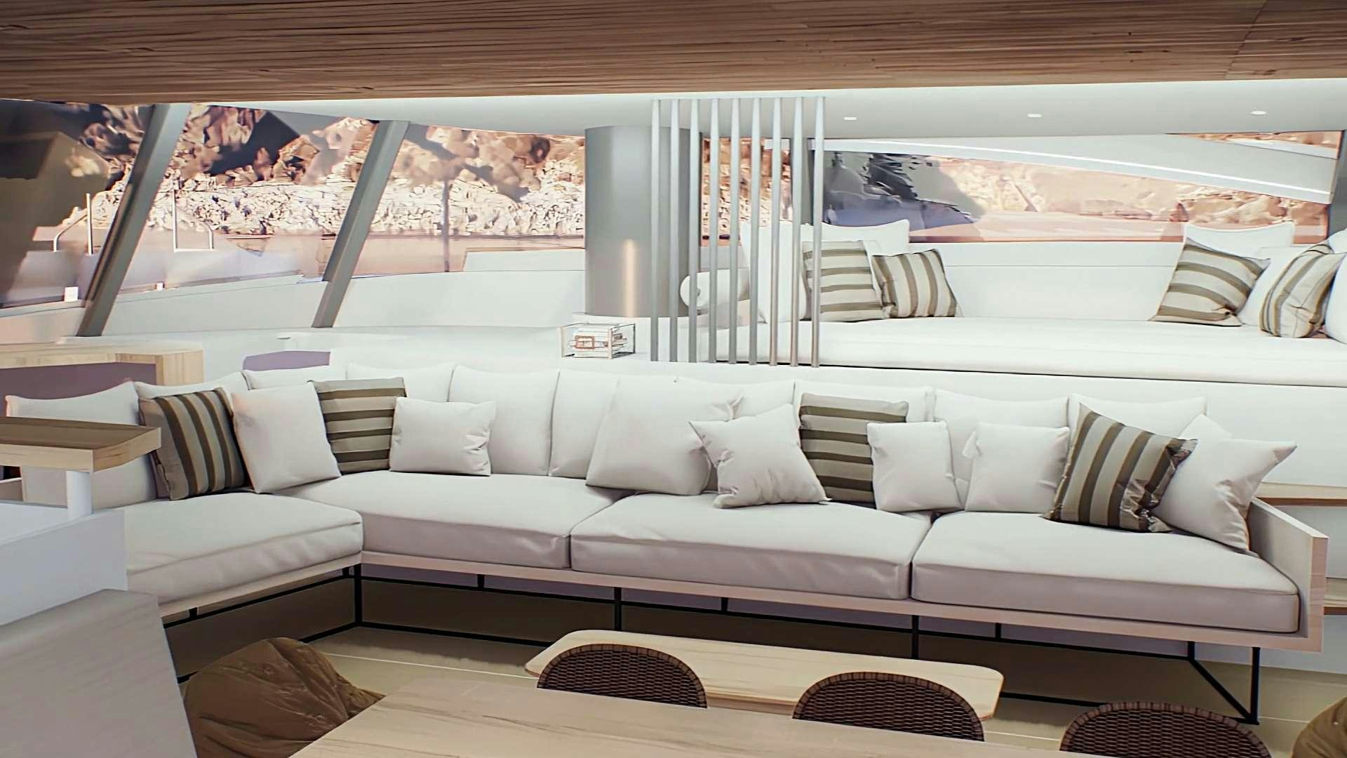 a couch and a table in a room aboard GANANY Yacht for Charter