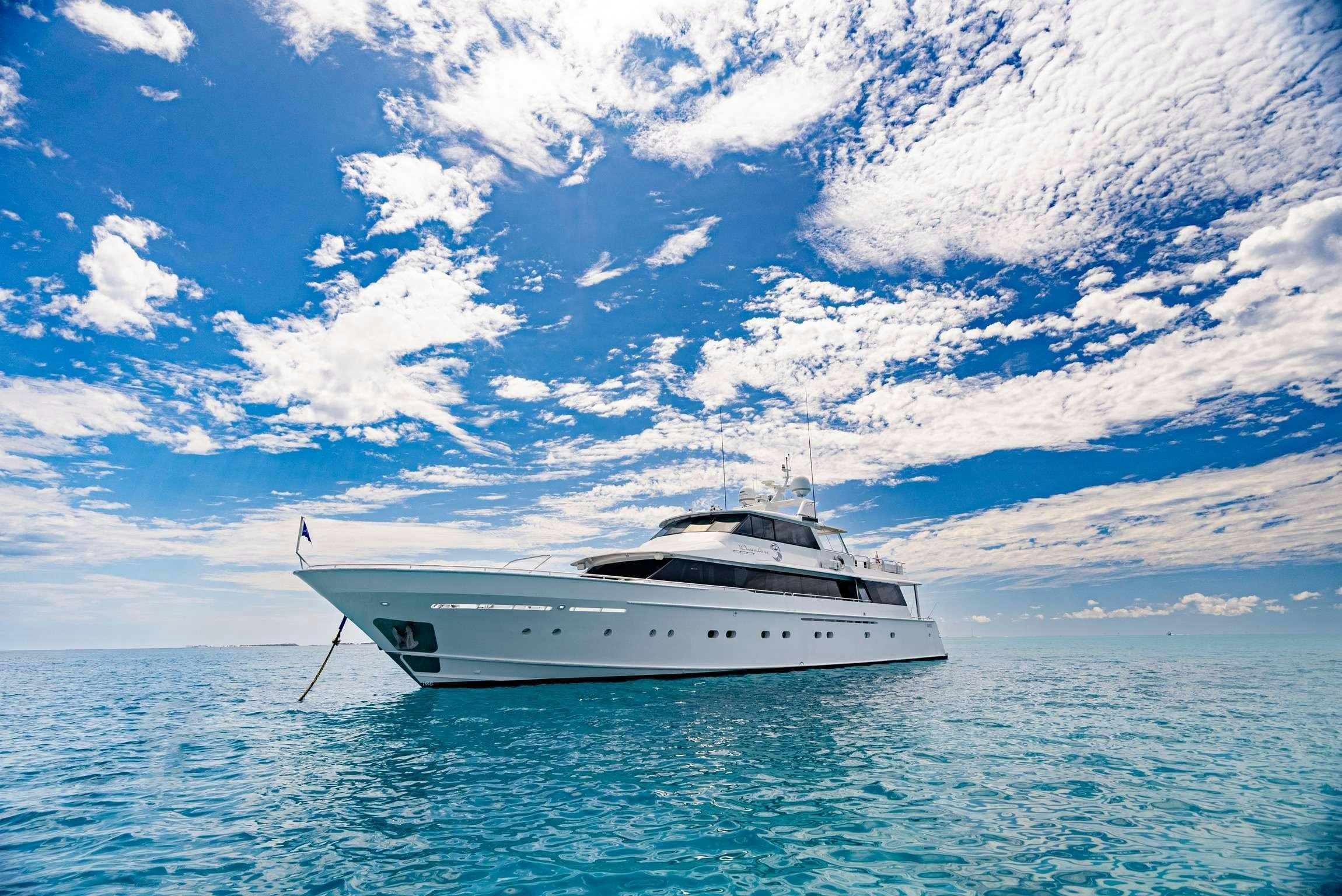 a white yacht in the water aboard SHORETHING Yacht for Charter