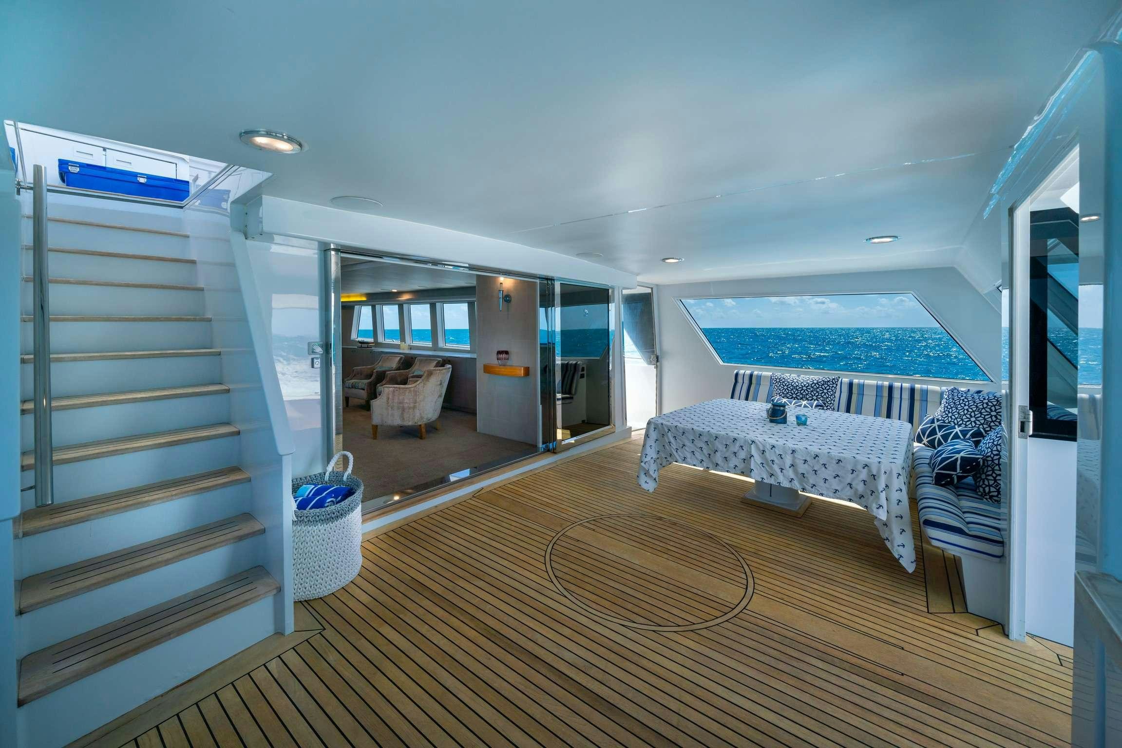 a room with a bed and a pool aboard SHORETHING Yacht for Charter