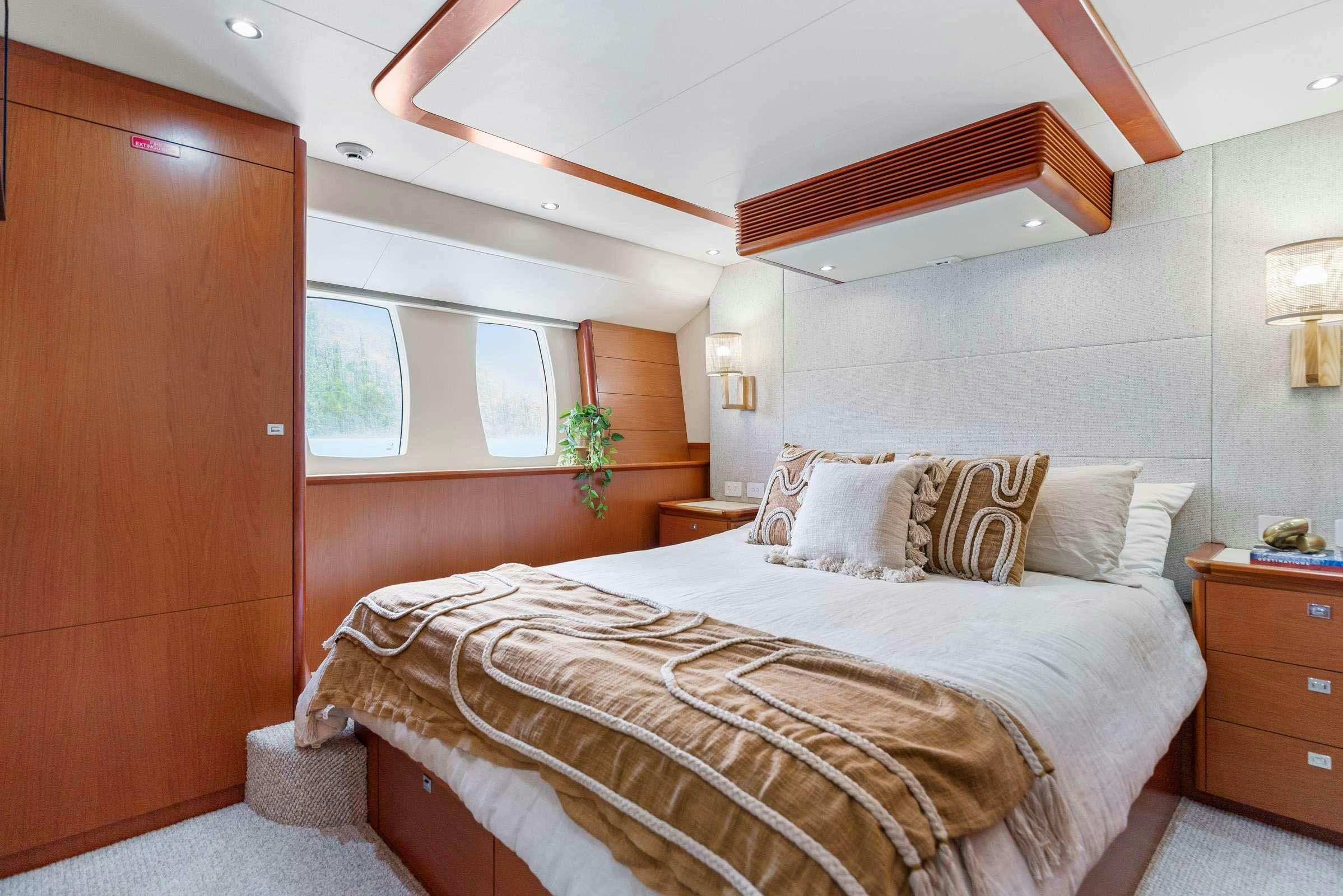 a bed in a room aboard MATRIX III Yacht for Charter