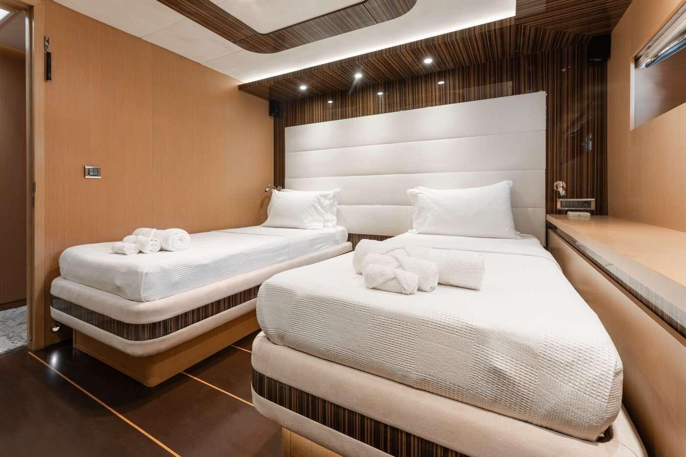 a room with two beds aboard MONE Yacht for Charter