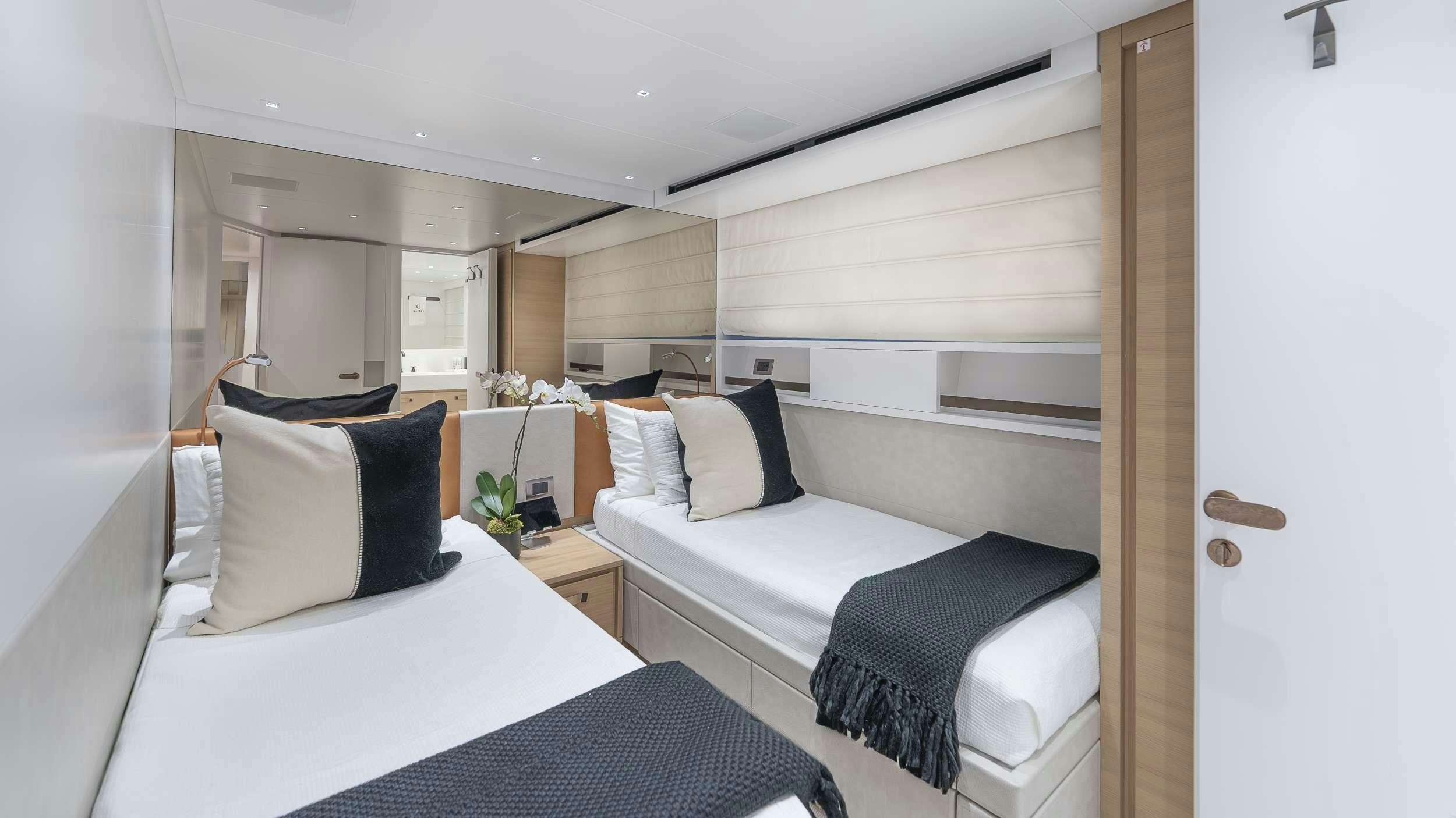 a room with two beds aboard GATSBY Yacht for Charter