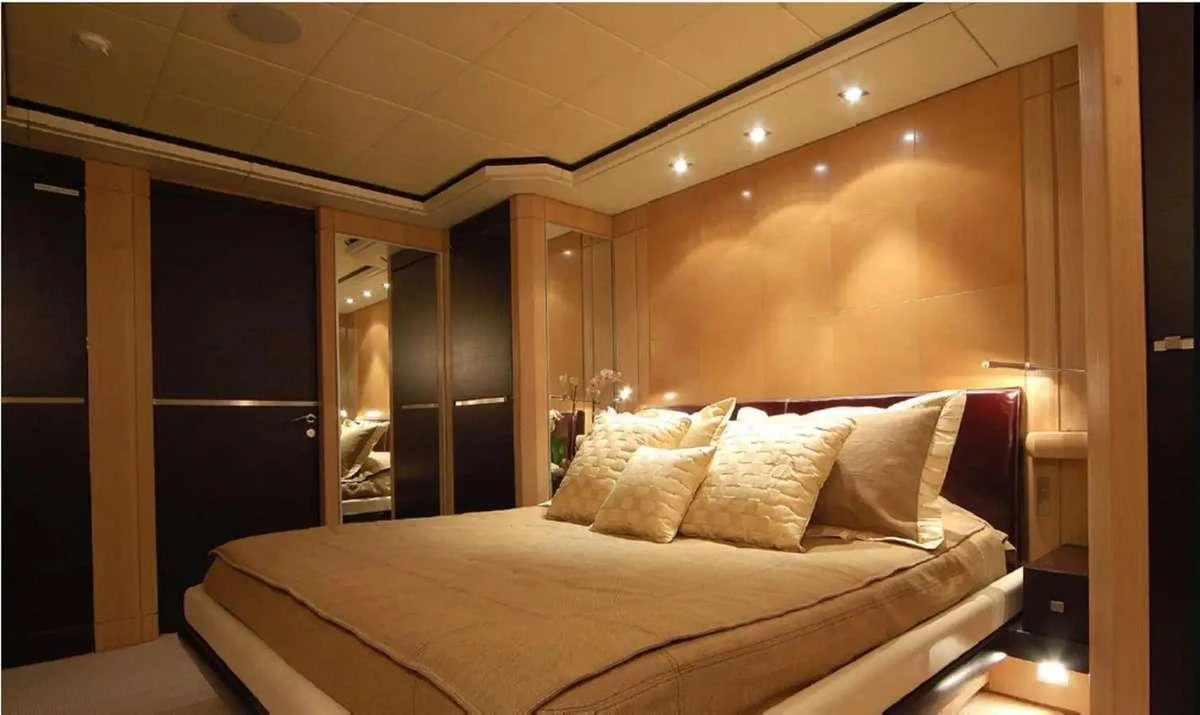 a bed with white sheets aboard PENELOPE Yacht for Charter