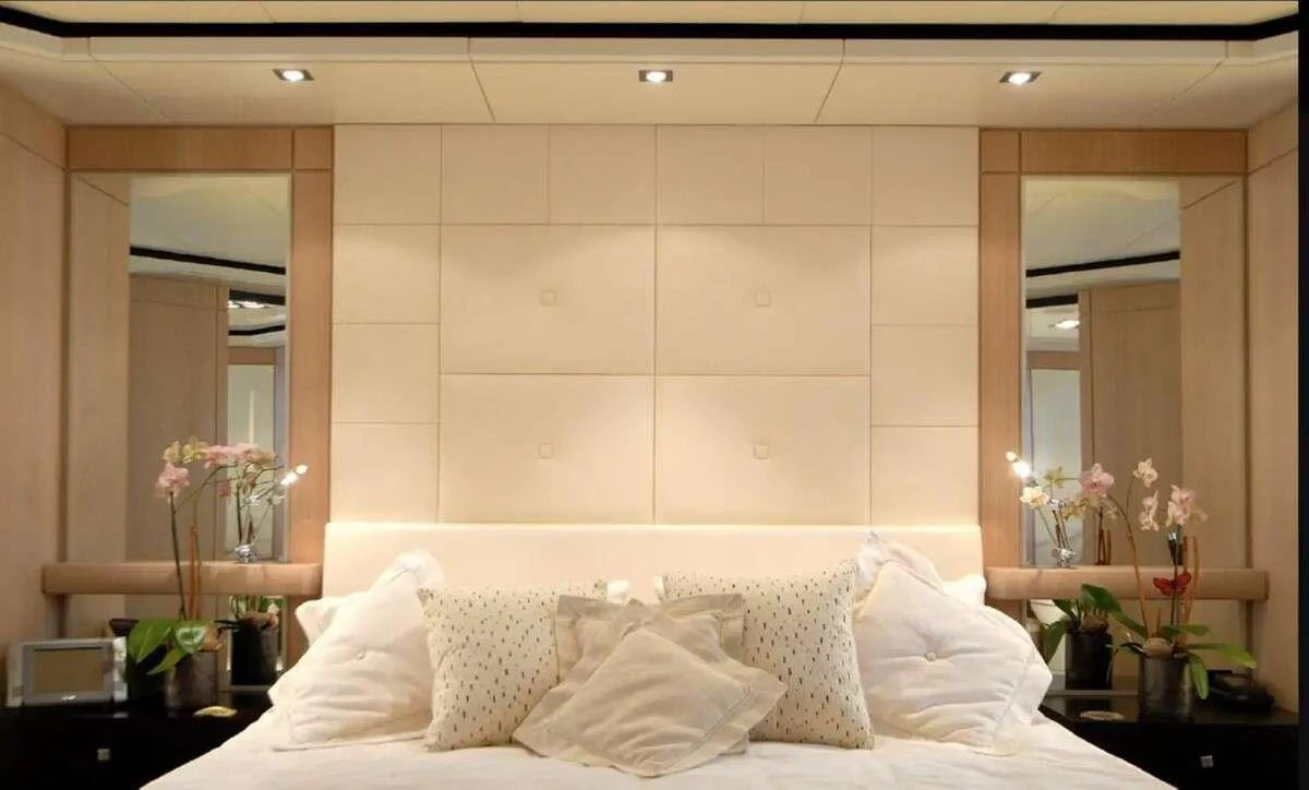 a bed with white sheets aboard PENELOPE Yacht for Charter