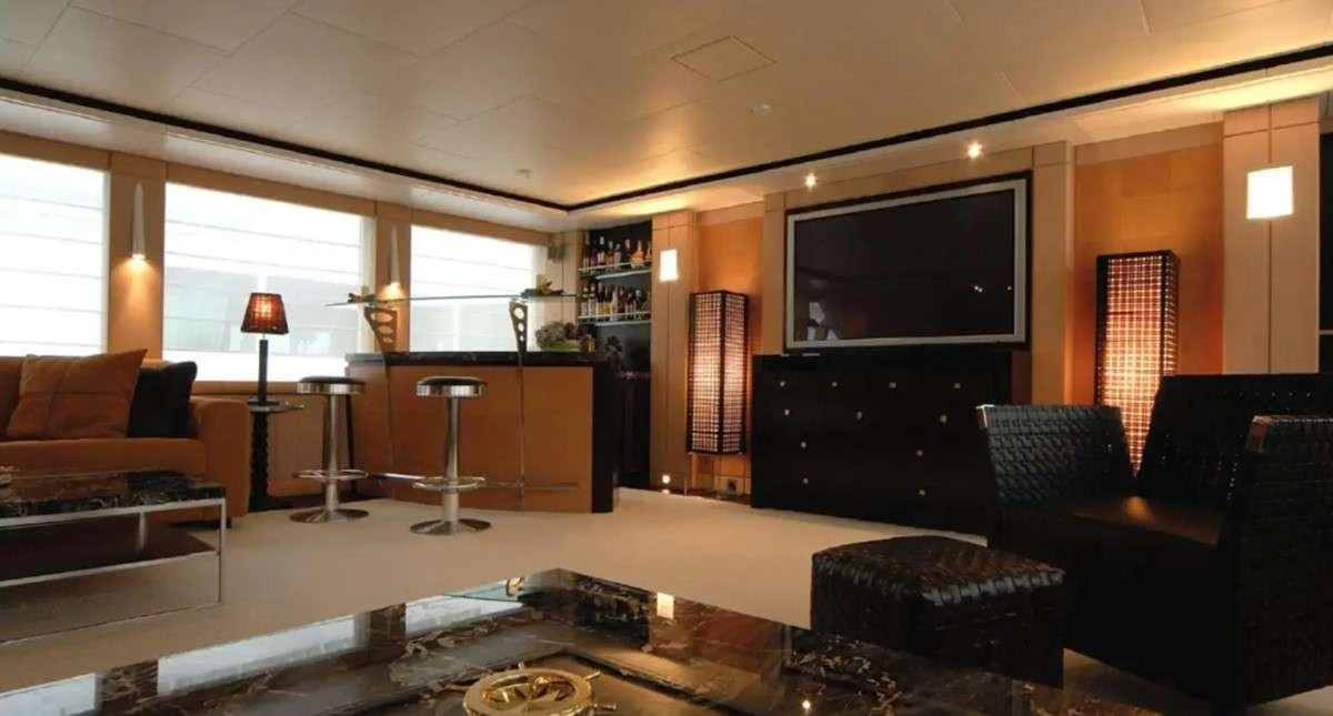 a living room with a tv and a fireplace aboard PENELOPE Yacht for Charter