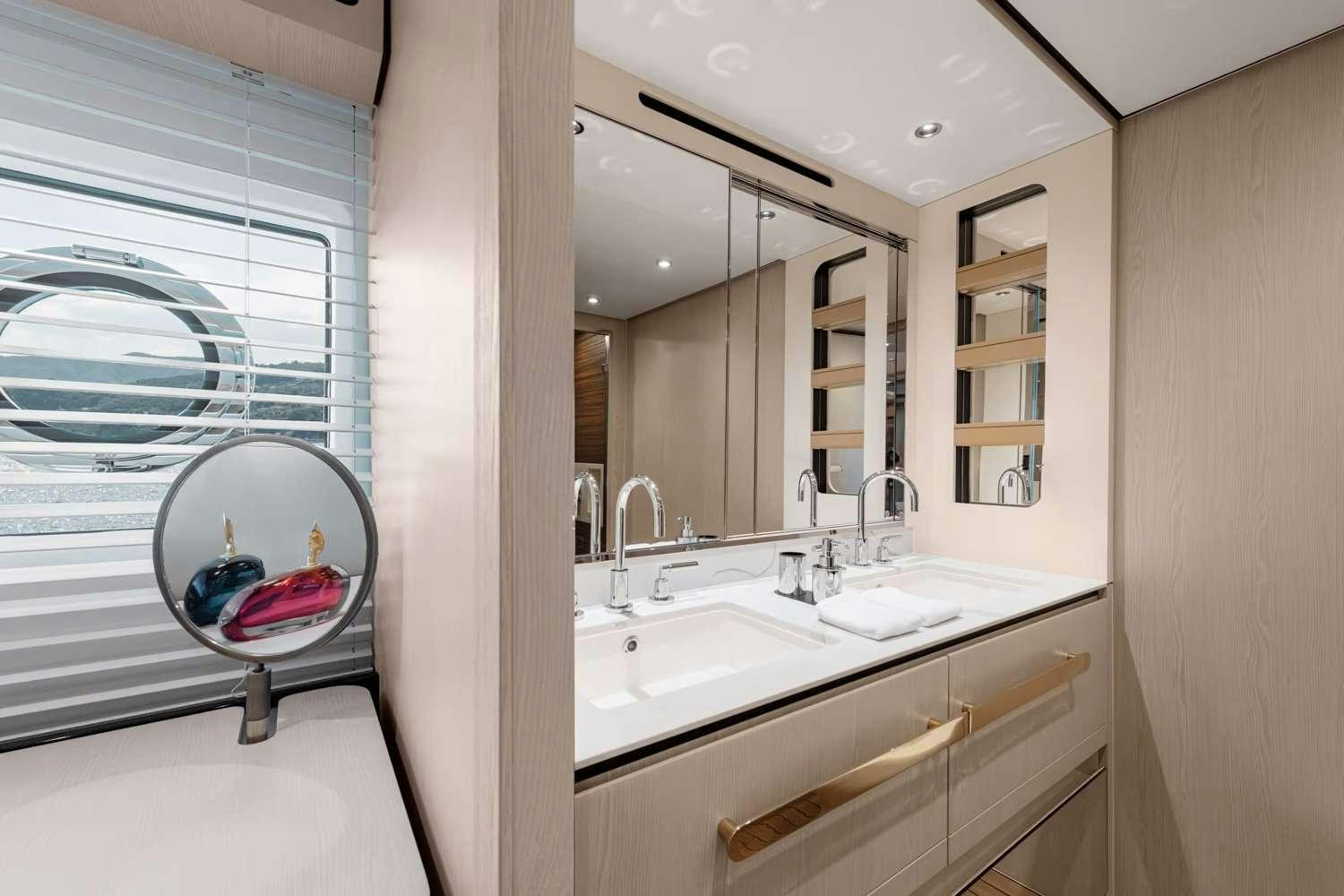 a bathroom with a large mirror aboard DT78 Yacht for Charter