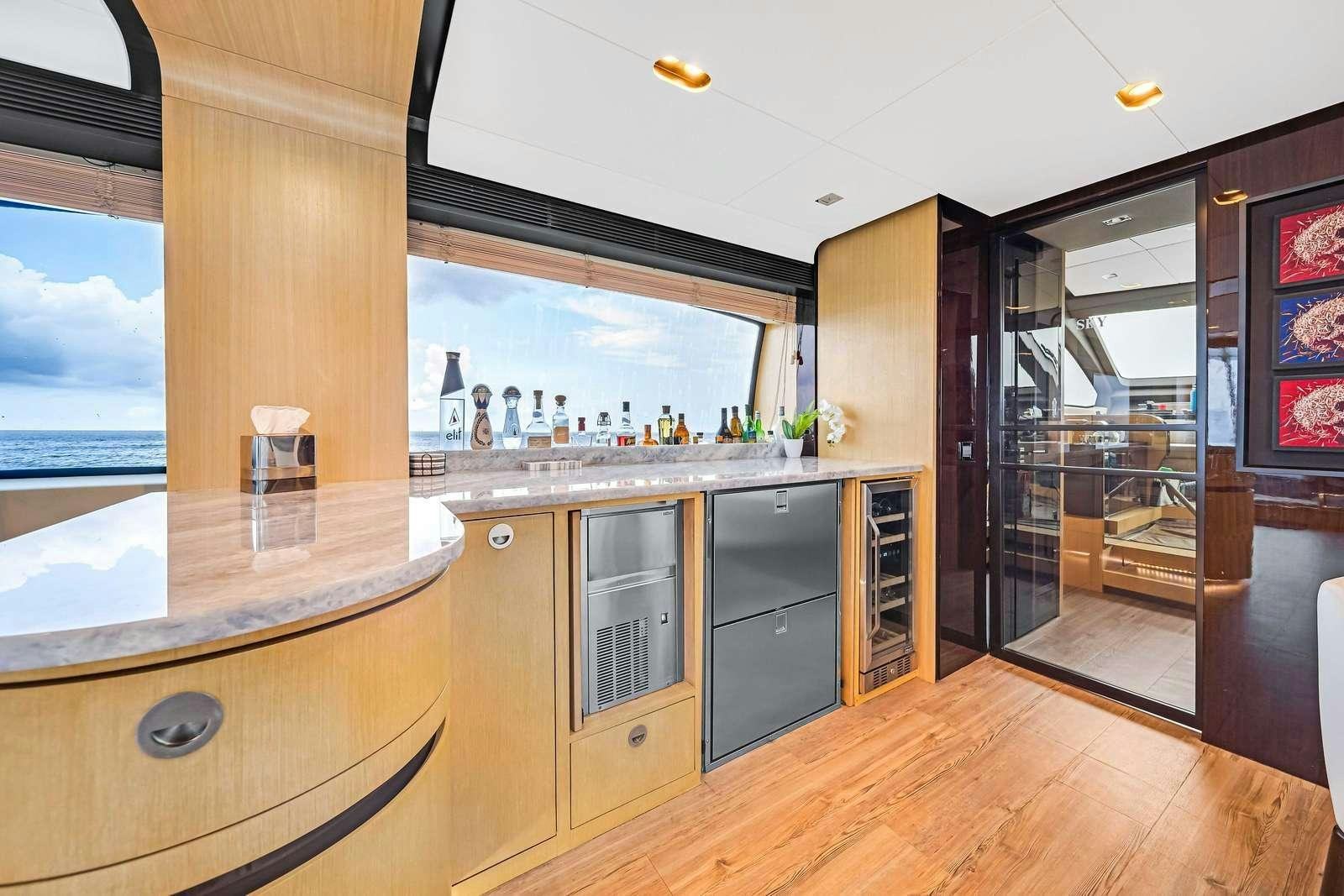 a kitchen with a bar and a bar aboard SKY Yacht for Charter