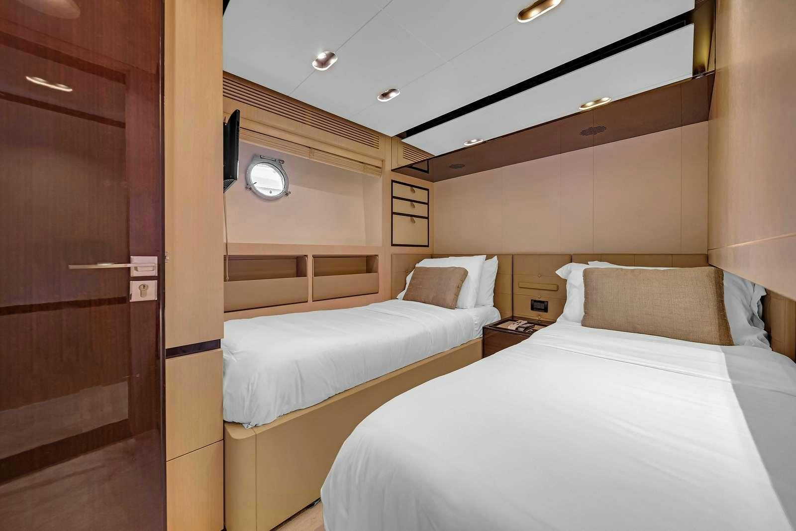 a room with two beds aboard SKY Yacht for Charter