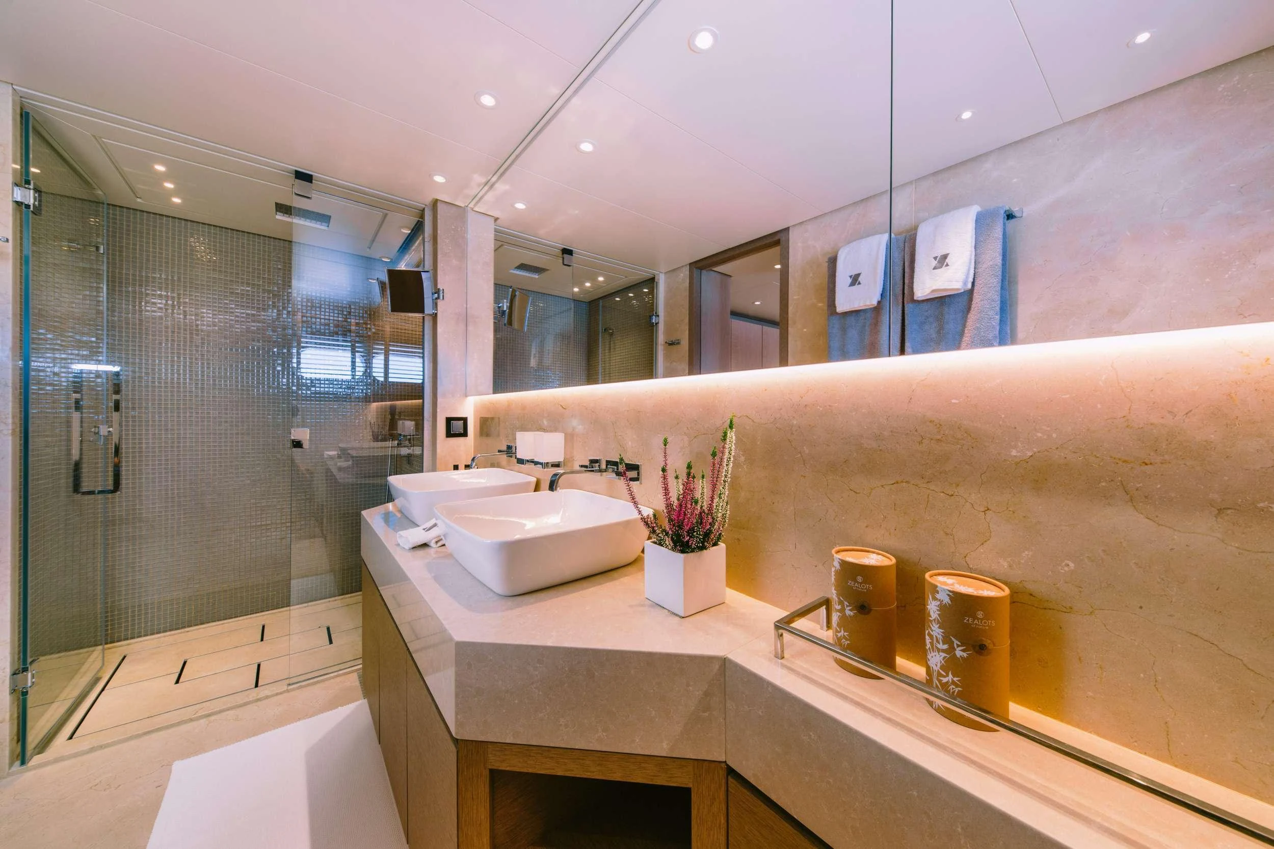 a bathroom with a glass shower aboard XANA Yacht for Charter