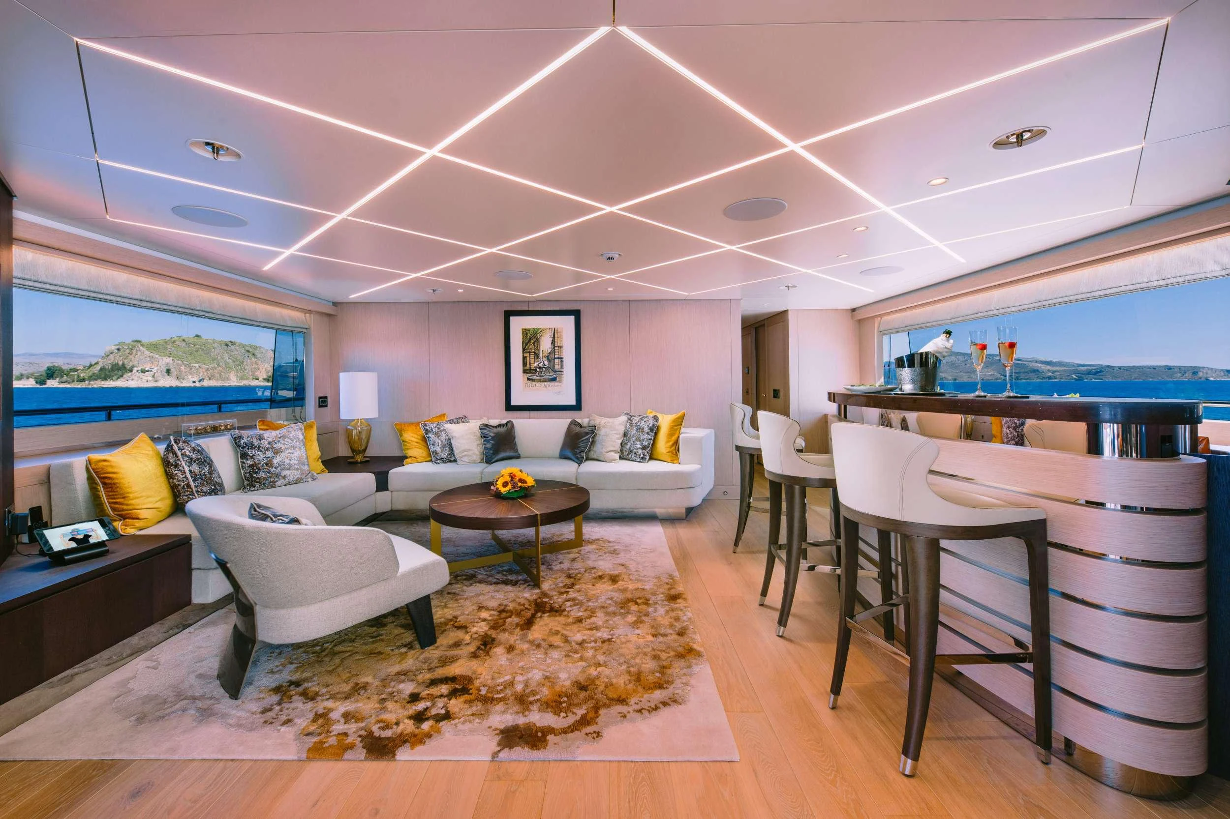 a living room with a large window aboard XANA Yacht for Charter