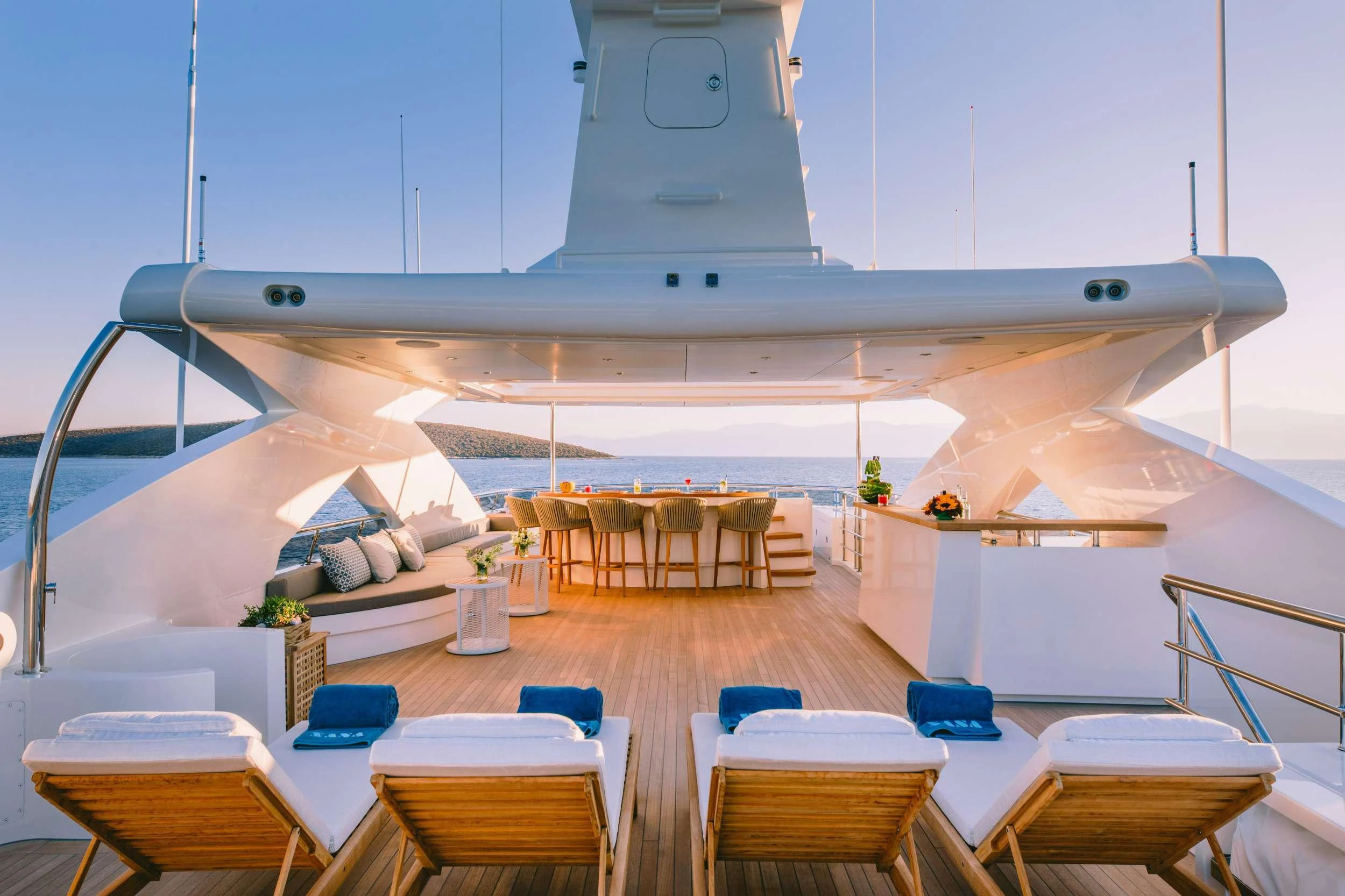 a room with tables and chairs aboard XANA Yacht for Charter