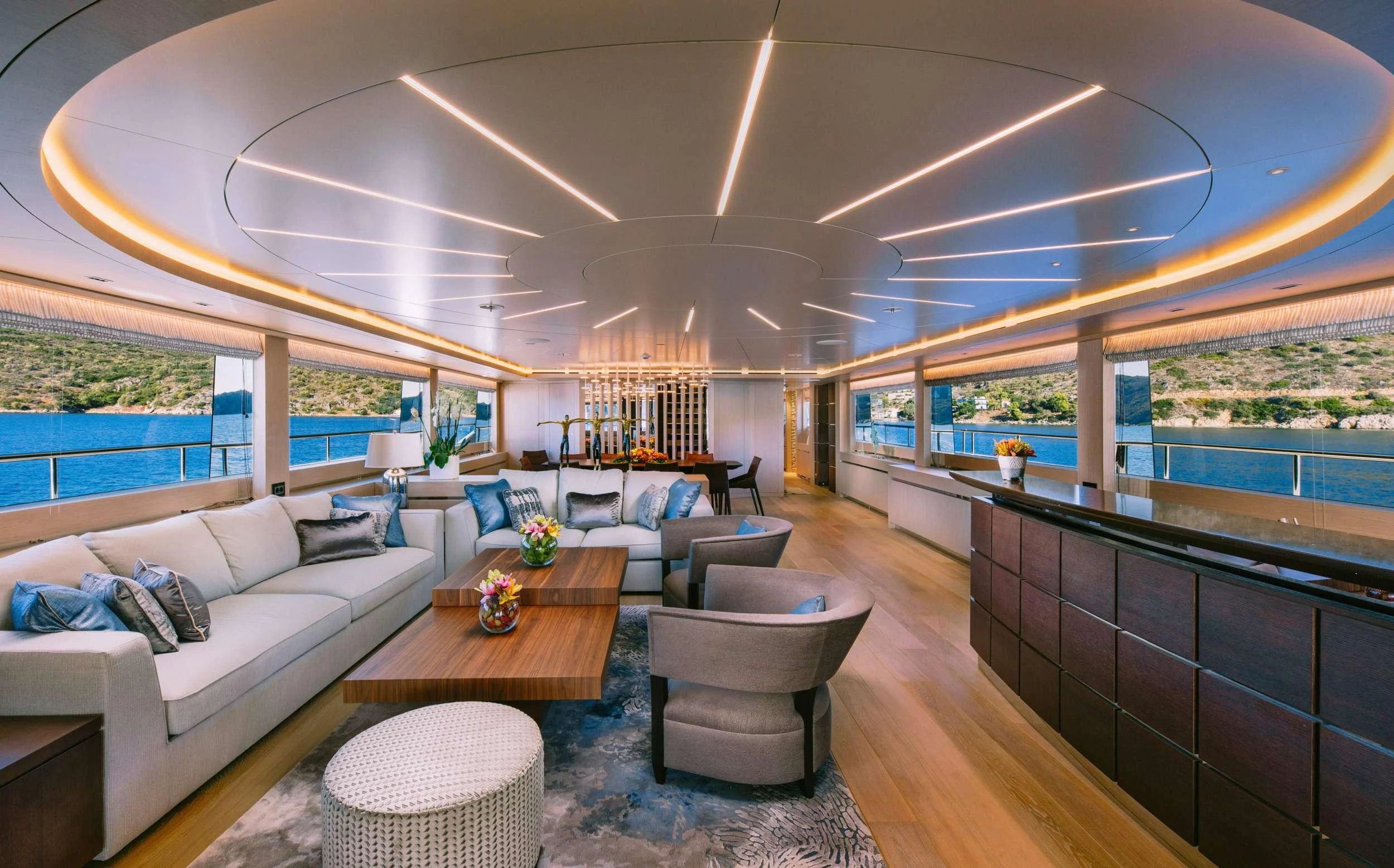 a living room with a large window aboard XANA Yacht for Charter
