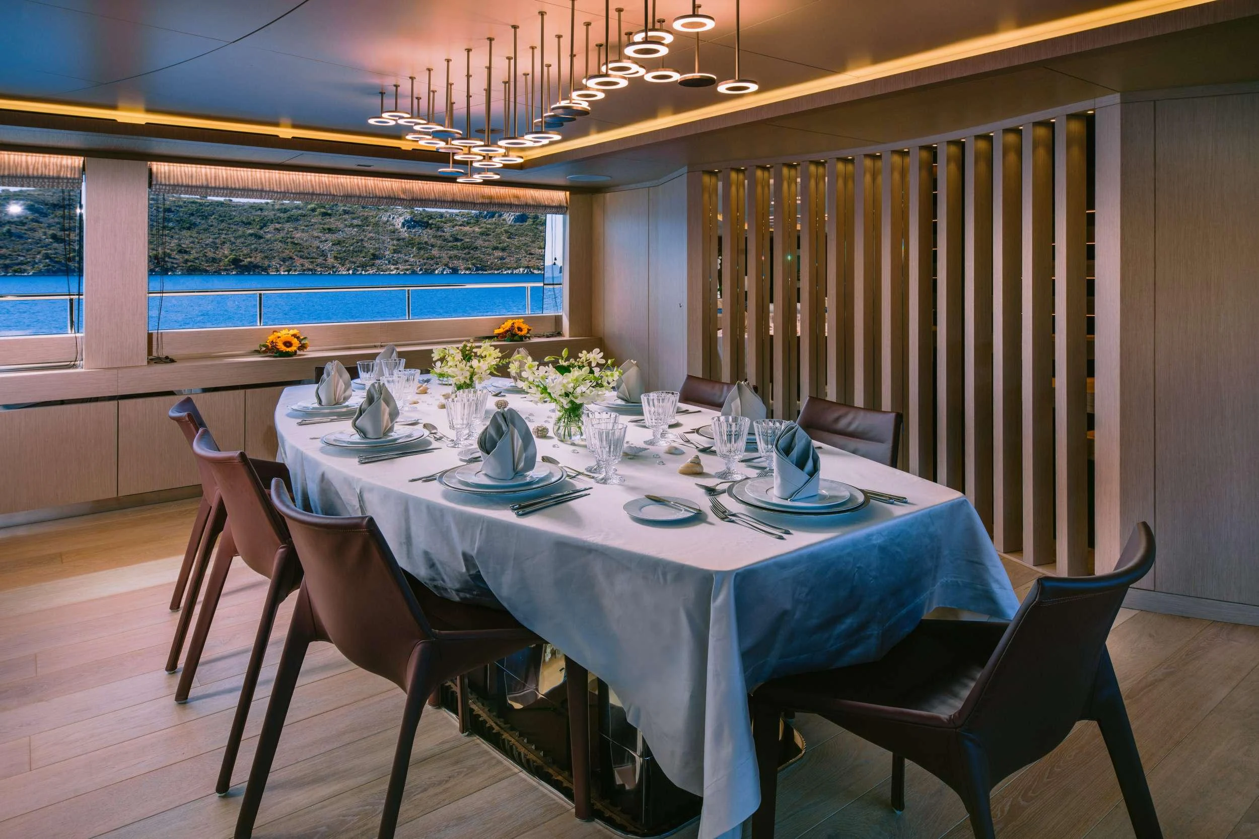 a dining table set for a meal aboard XANA Yacht for Charter