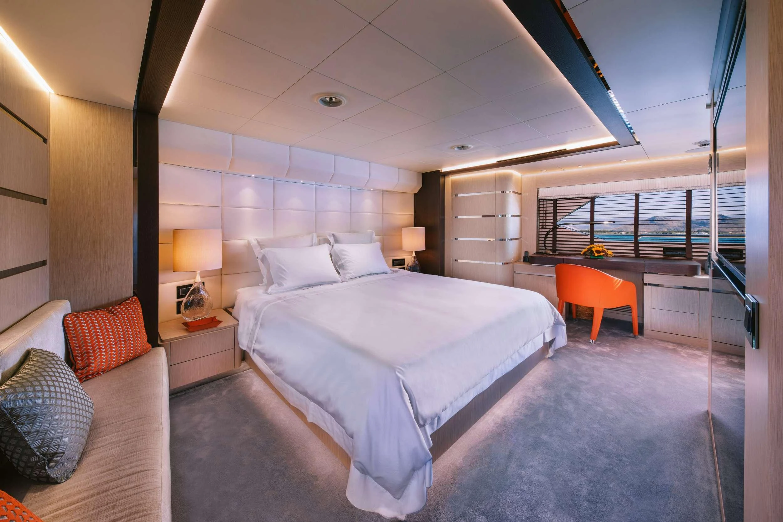 a bedroom with a large bed aboard XANA Yacht for Charter