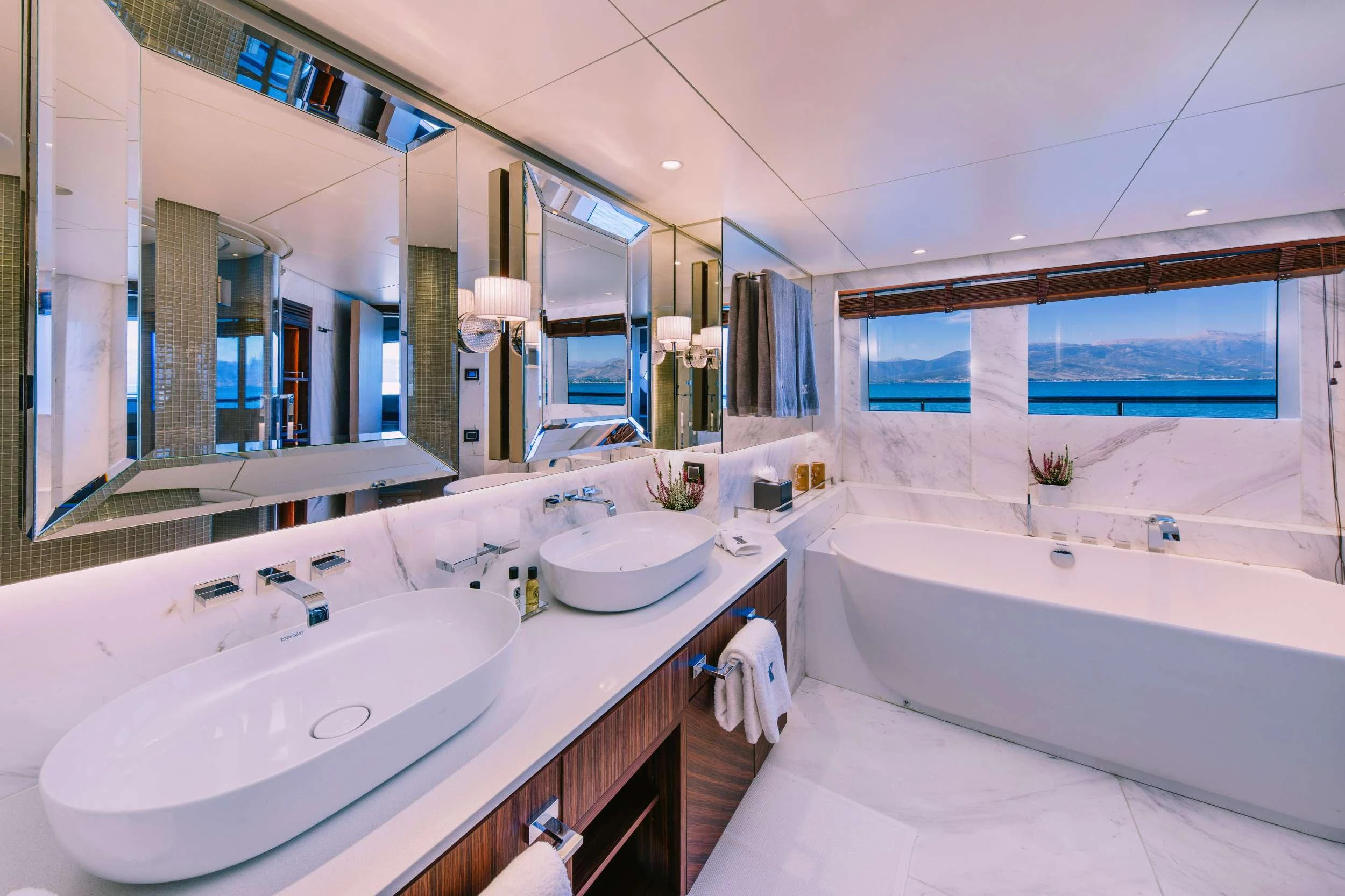 a bathroom with a large mirror aboard XANA Yacht for Charter