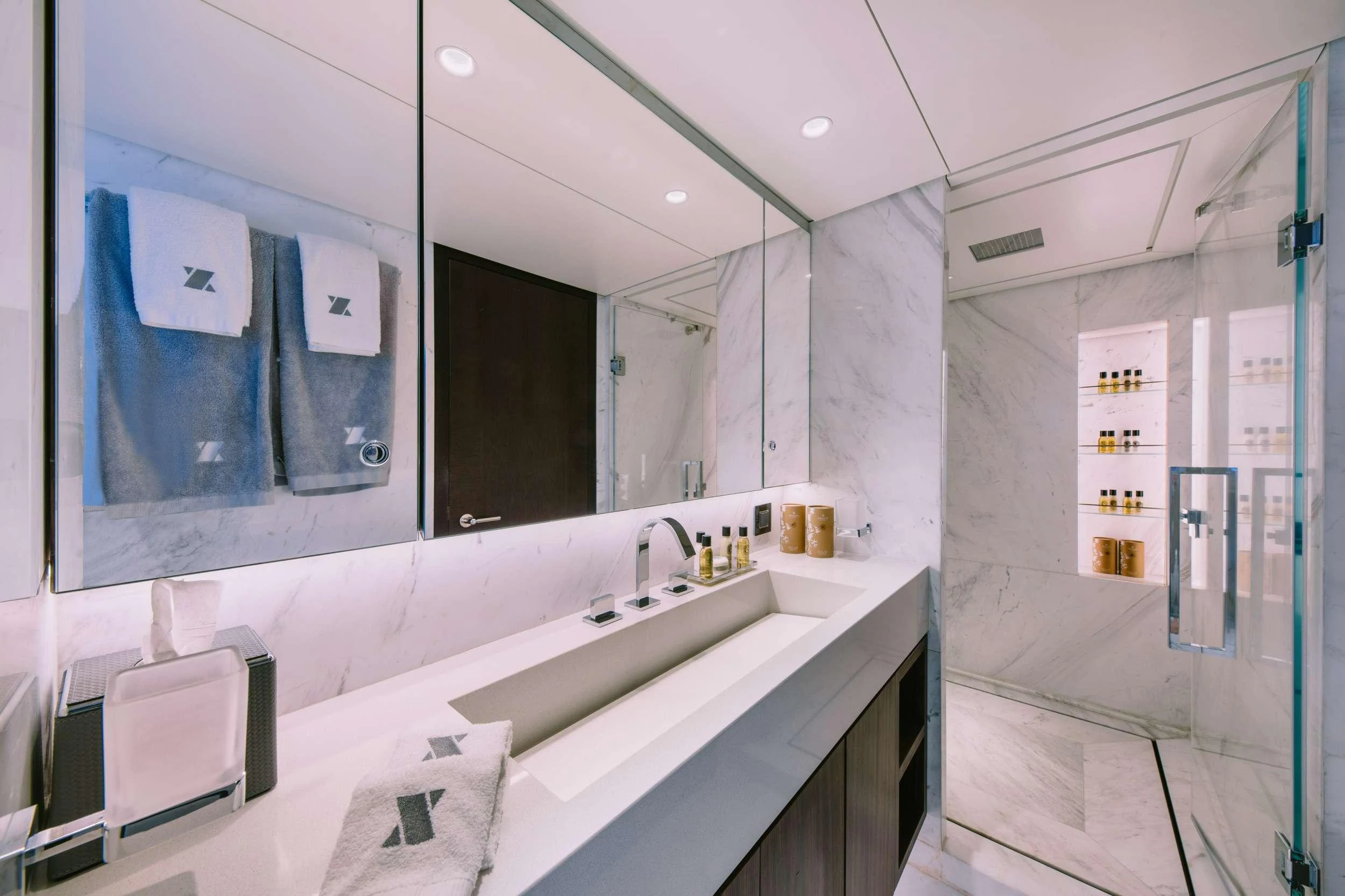 a bathroom with a large mirror aboard XANA Yacht for Charter