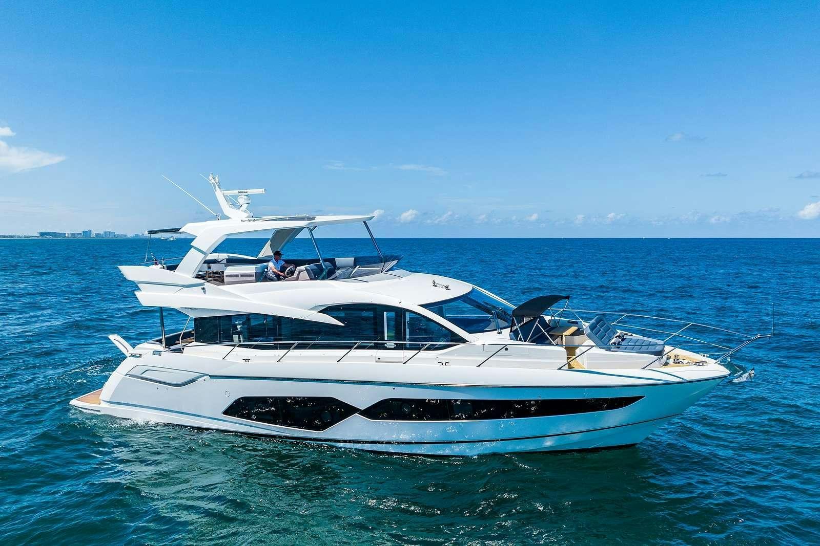 a white yacht in the water aboard DONE DEAL Yacht for Charter