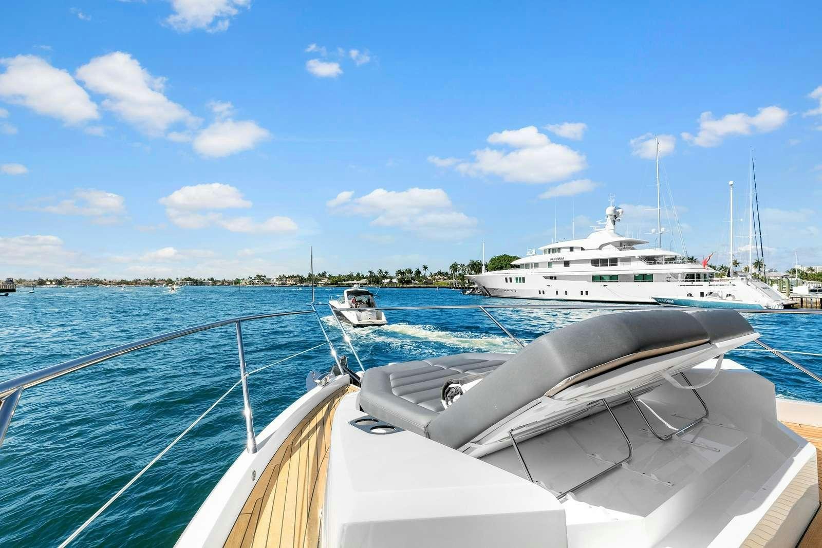 a group of boats on a body of water aboard DONE DEAL Yacht for Charter