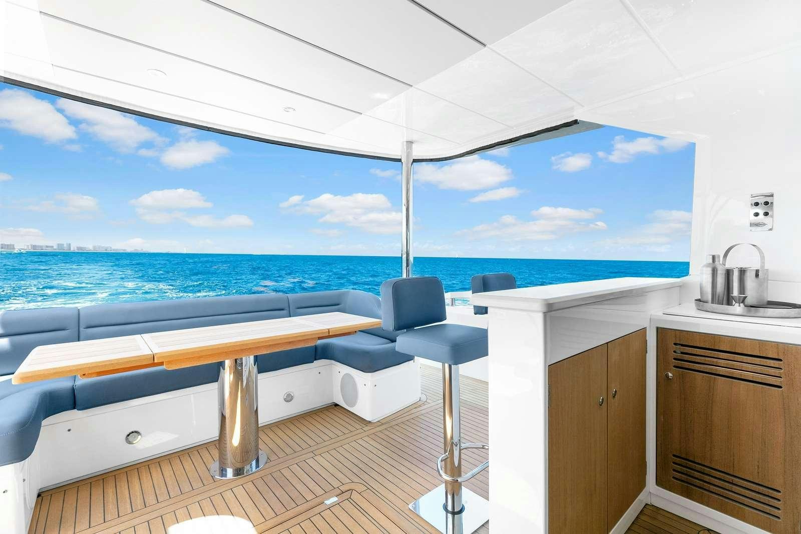 a kitchen with a view of the ocean aboard DONE DEAL Yacht for Charter