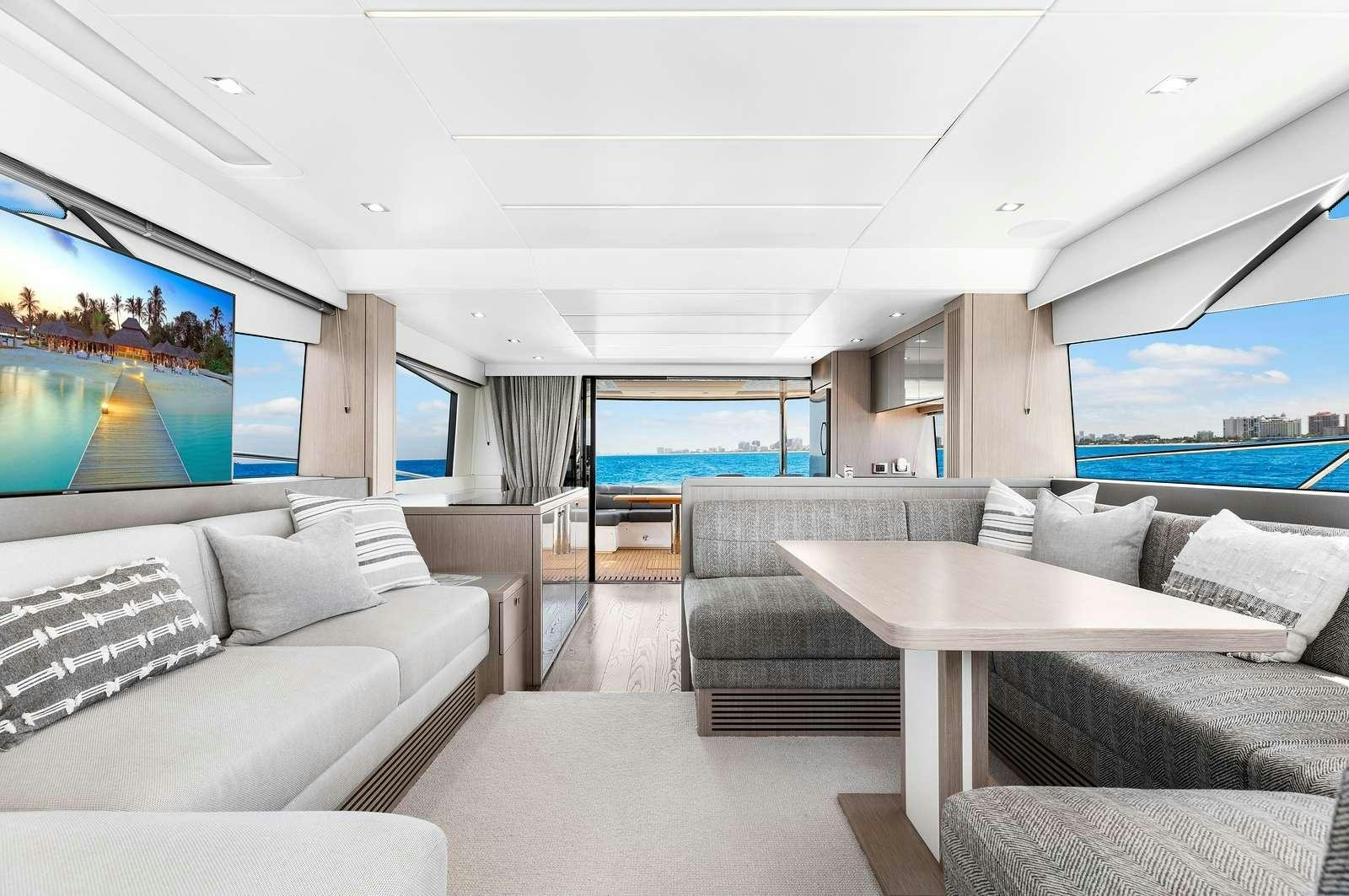a living room with a large window aboard DONE DEAL Yacht for Charter