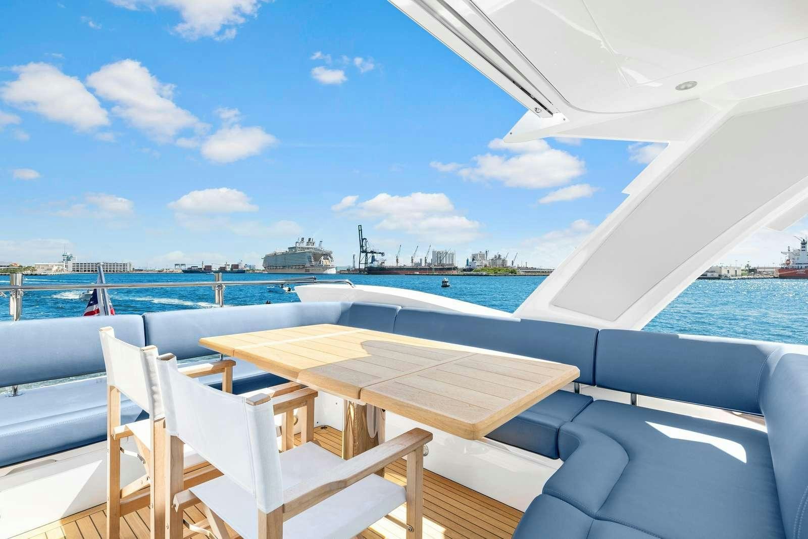 a table and chairs on a boat aboard DONE DEAL Yacht for Charter